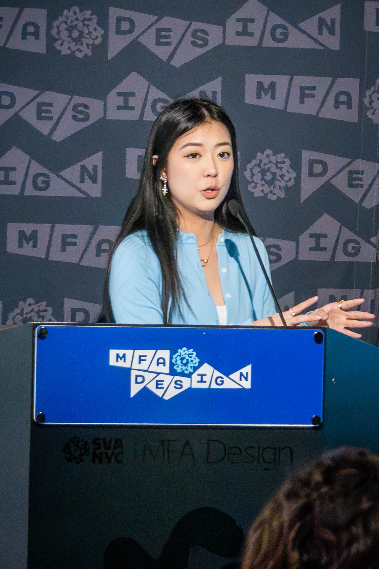 student at a podium giving a presentation