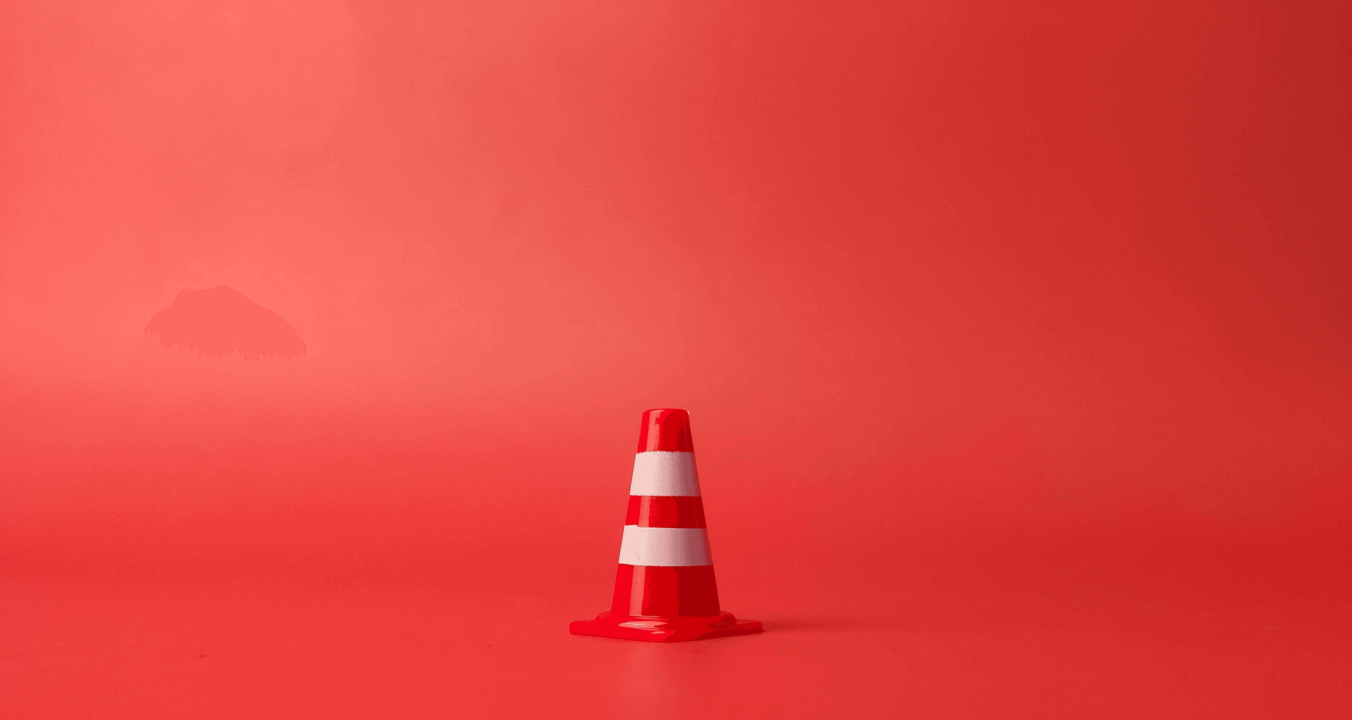 red flag on pole under blue sky during daytime