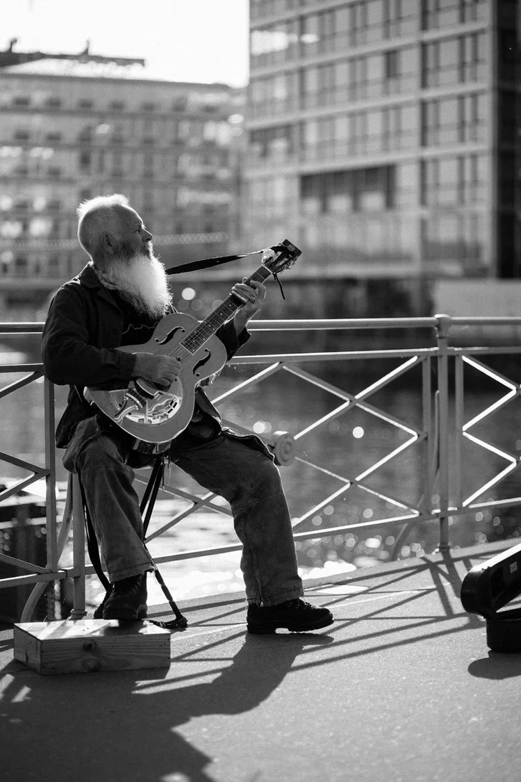 Local playing guitar in Geneva
