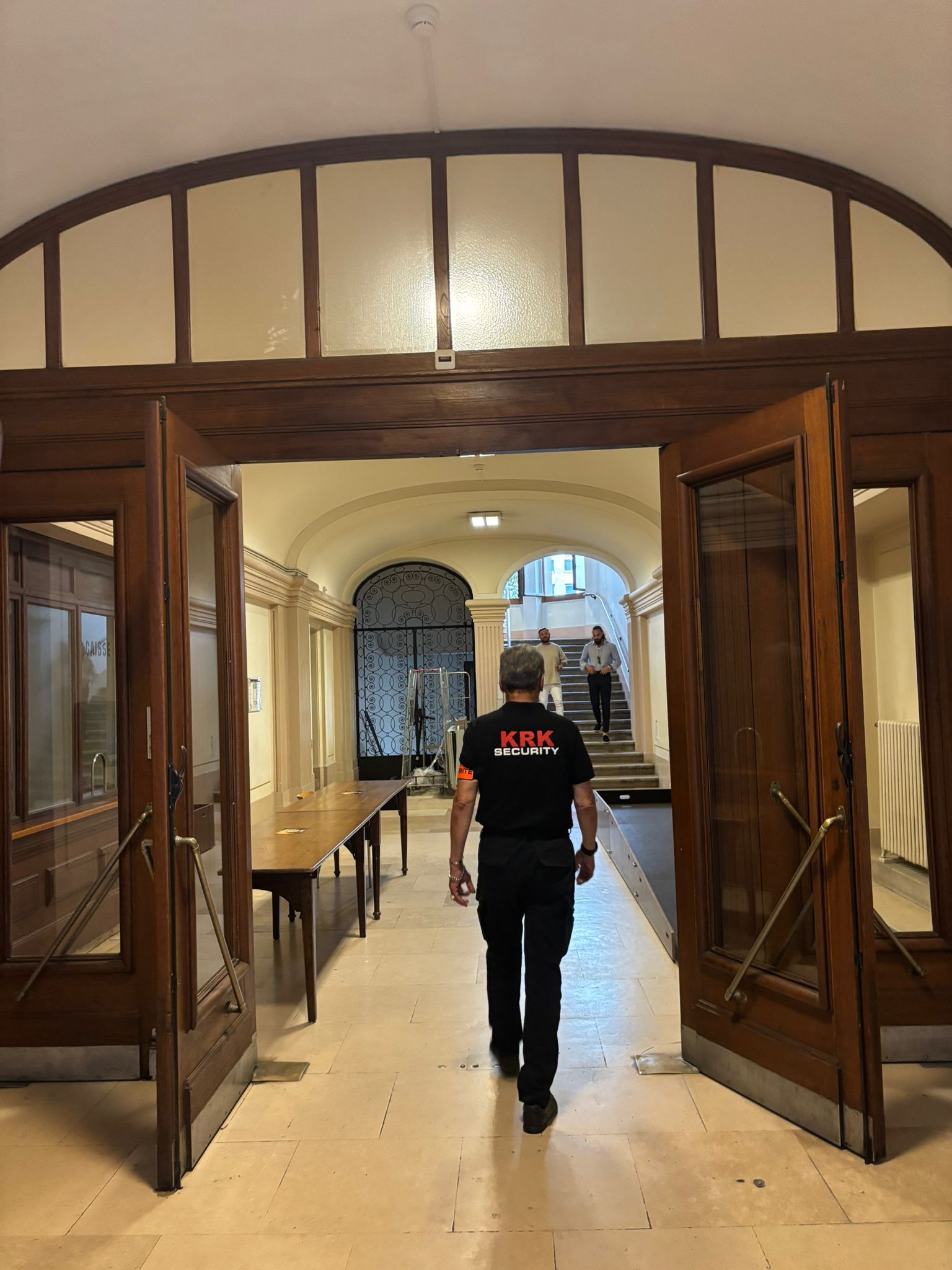 a woman holding a red flower