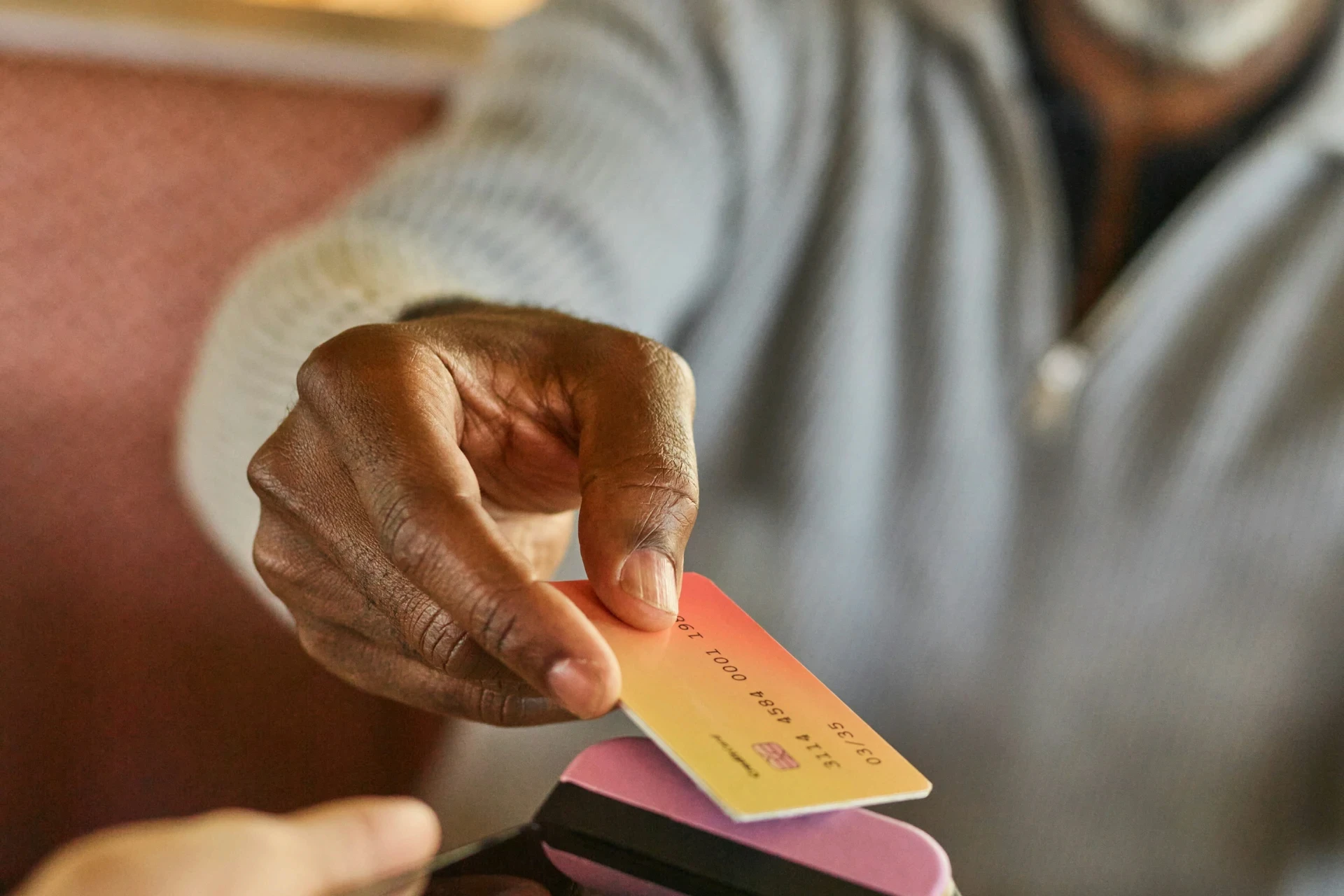 A man paying on a machine 