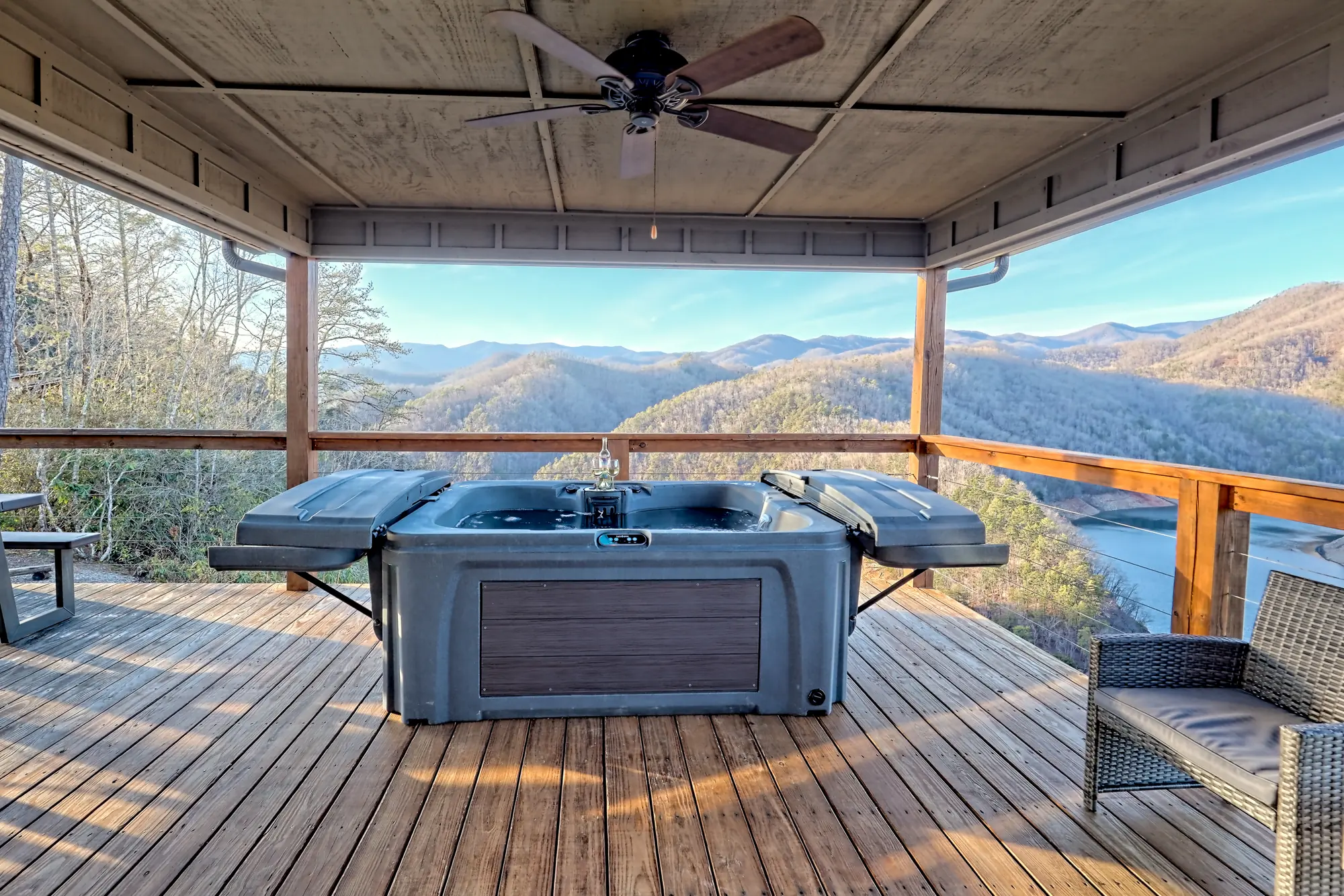 Eagles Landing covered deck with the hot tub and a view over the lake