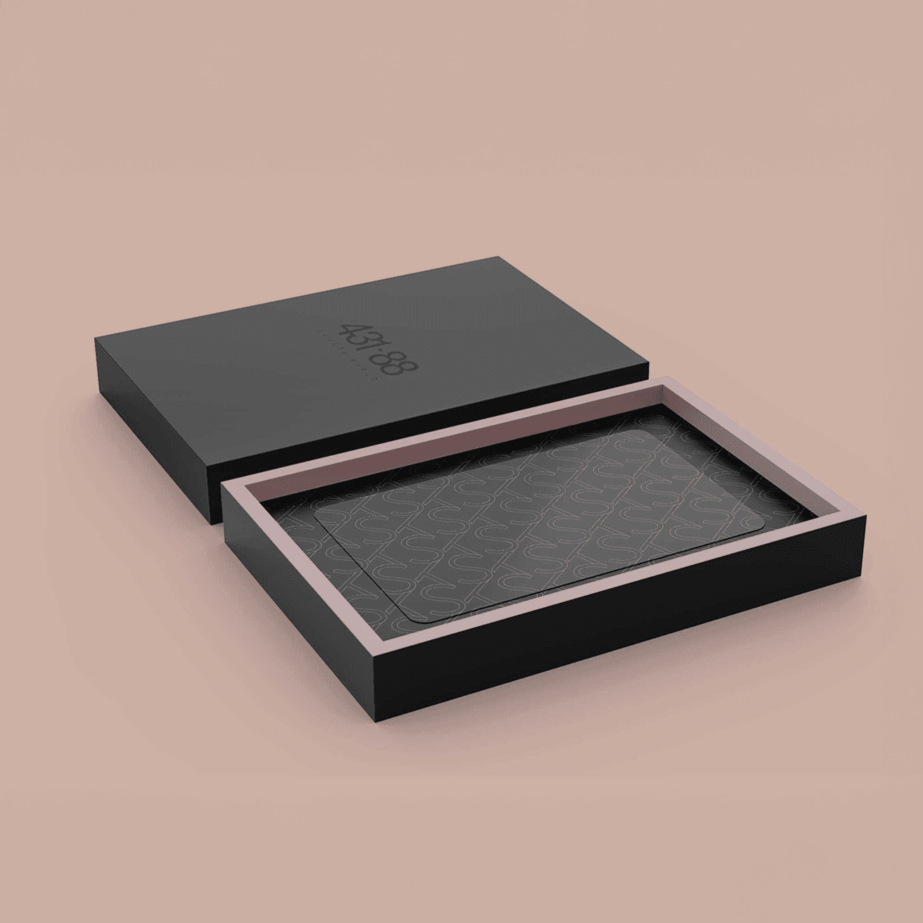 Matte black packaging with blind-emboss branding and modular inner tray