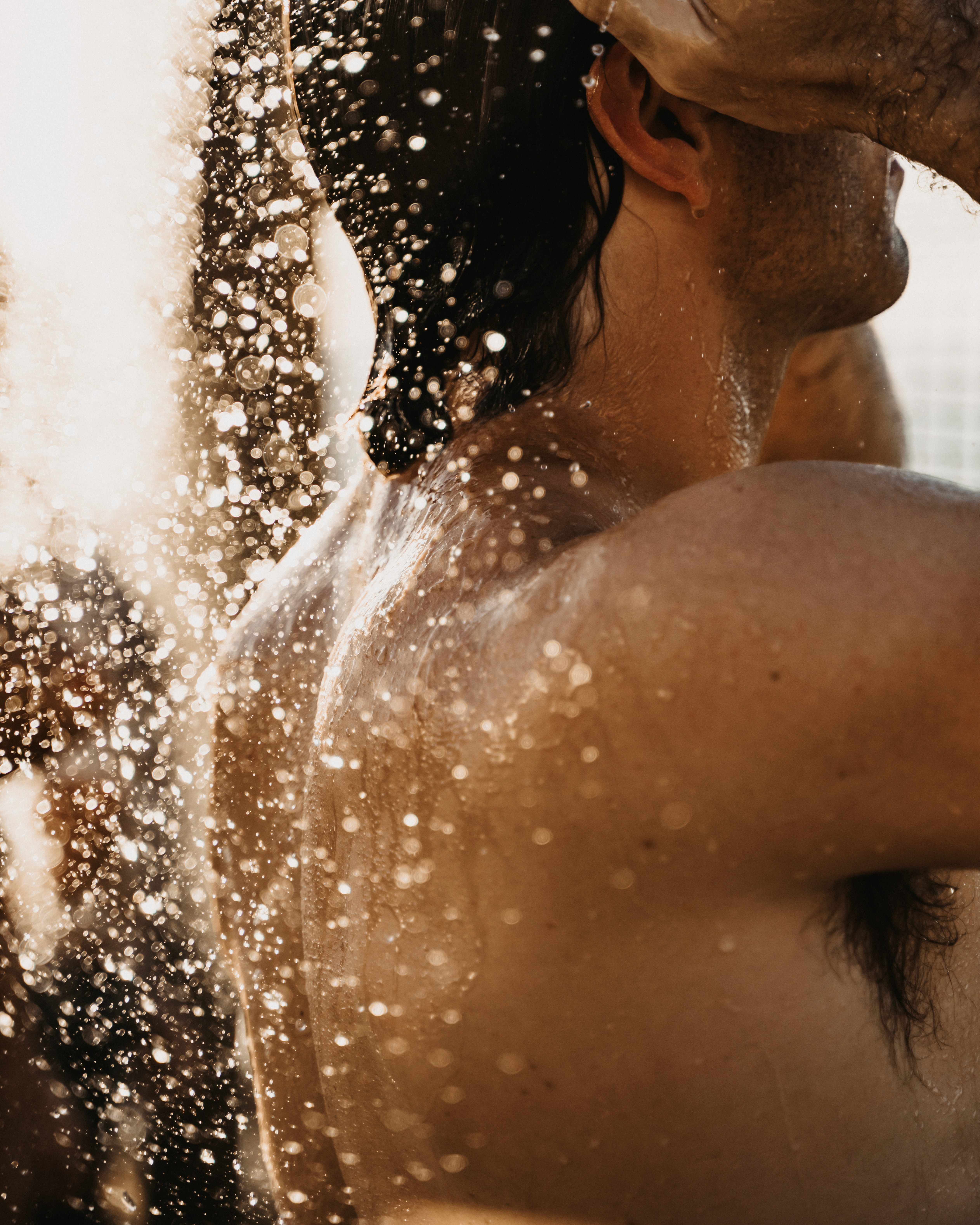 Man using the outdoor shower at SaunaHaüs on the Sea Point Promenade after a guided sauna.
