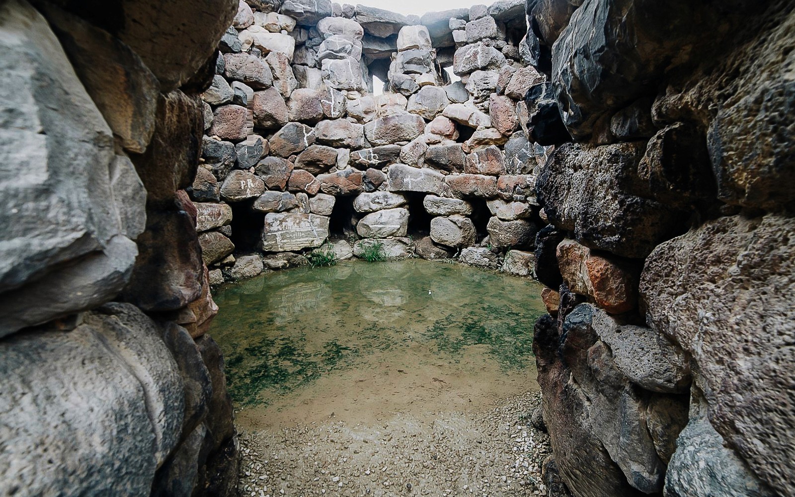 Stone chamber with water pool at Barumini UNESCO Site, Sardinia, Italy.