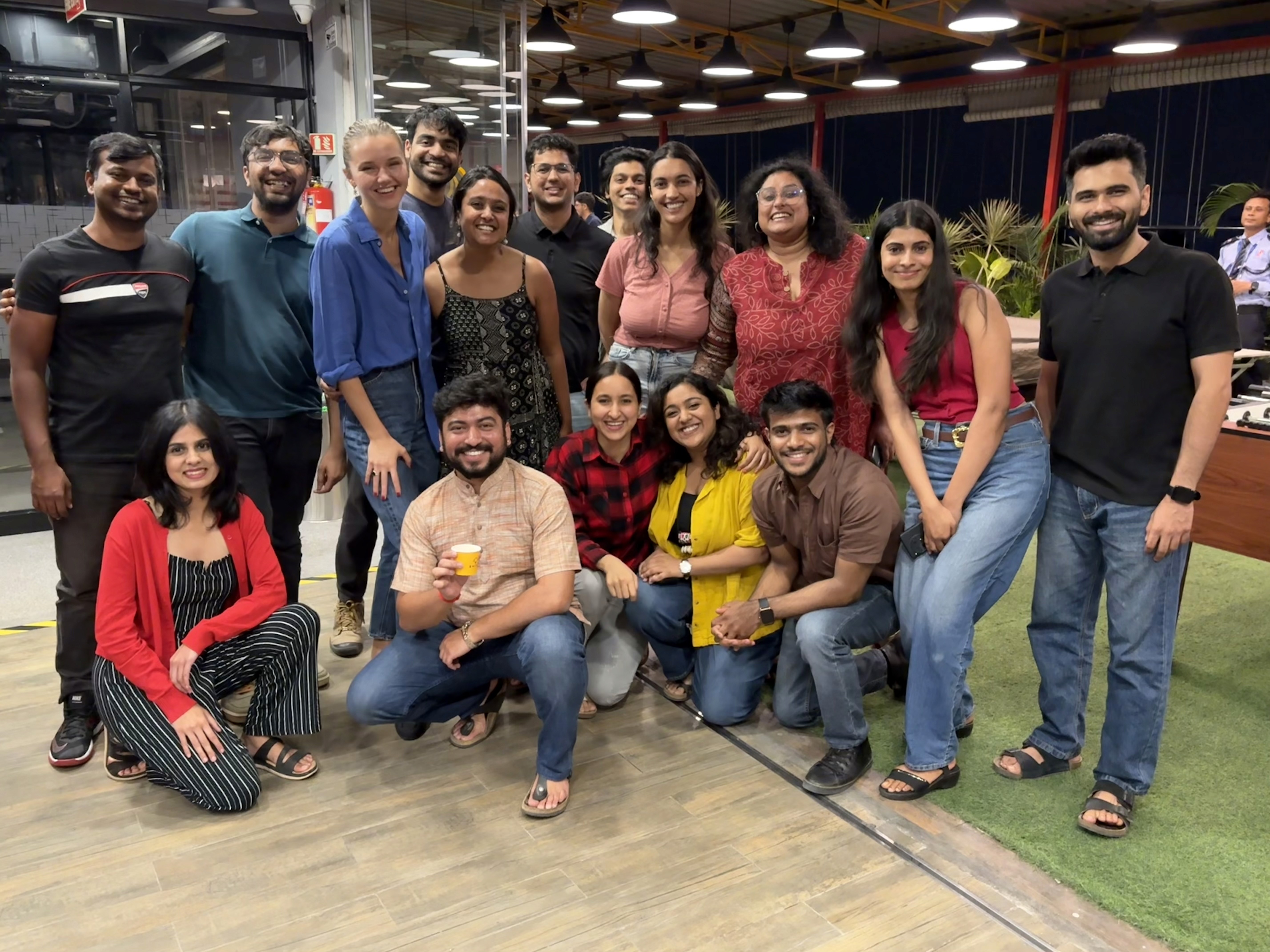 Members of the Bengaluru Global Shapers Hub-1 smiling in a casual office setting.