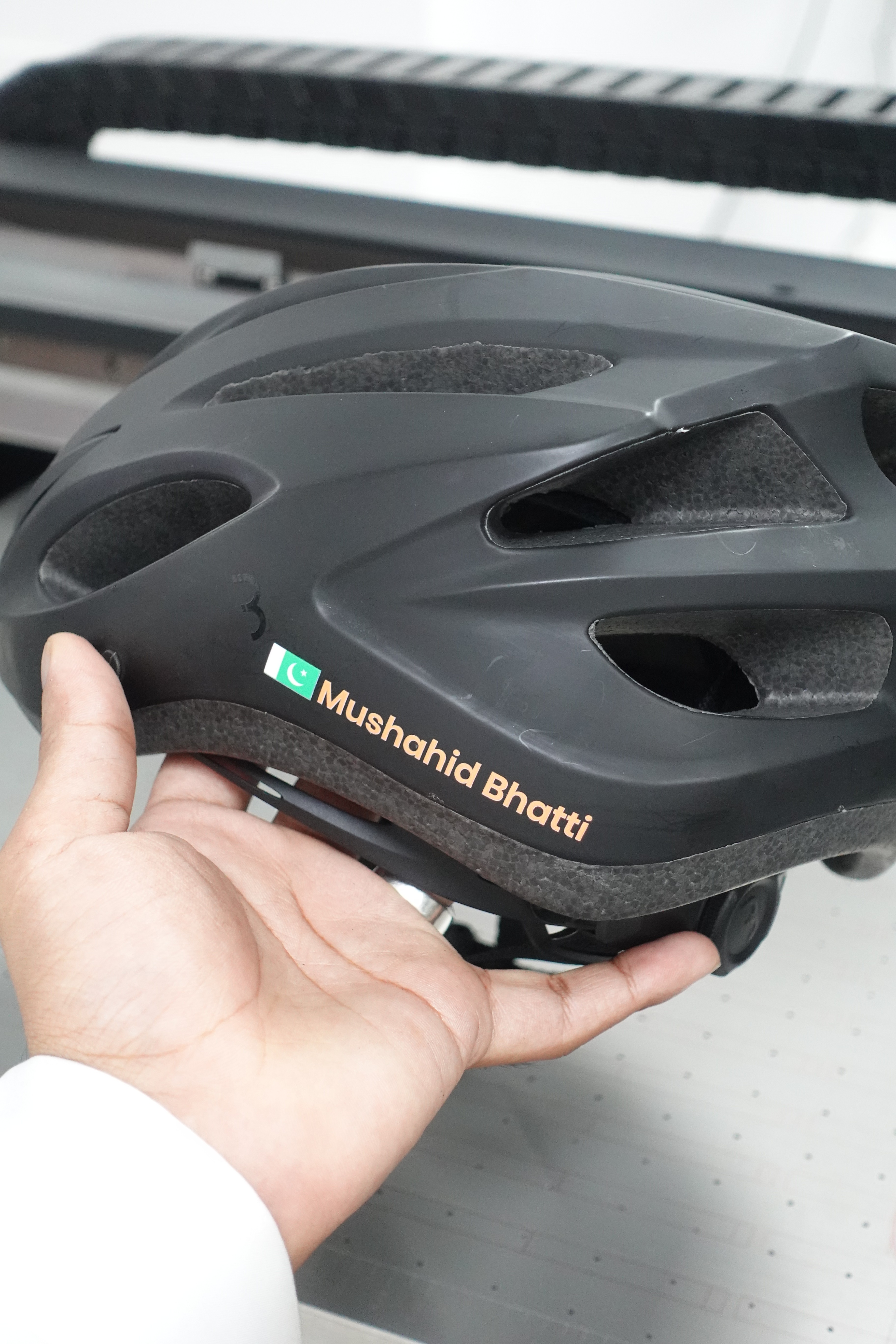 Custom UV DTF Stickers on a cycling helmet