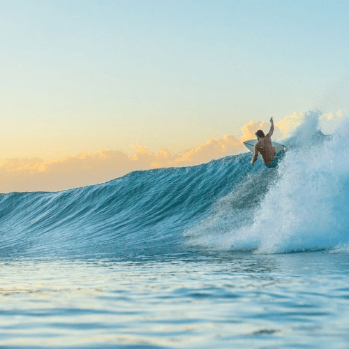 Man surfing on a wave – surfboard rental in santa-teresa