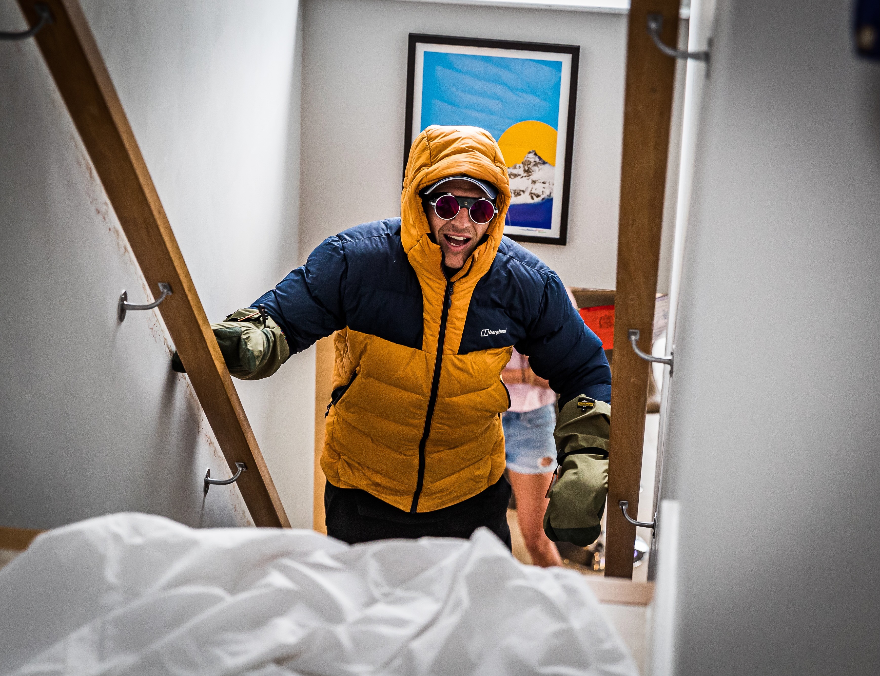 Ed Jackson in full mountain kit climbing the stairs at home during his 2020 Everest challenge