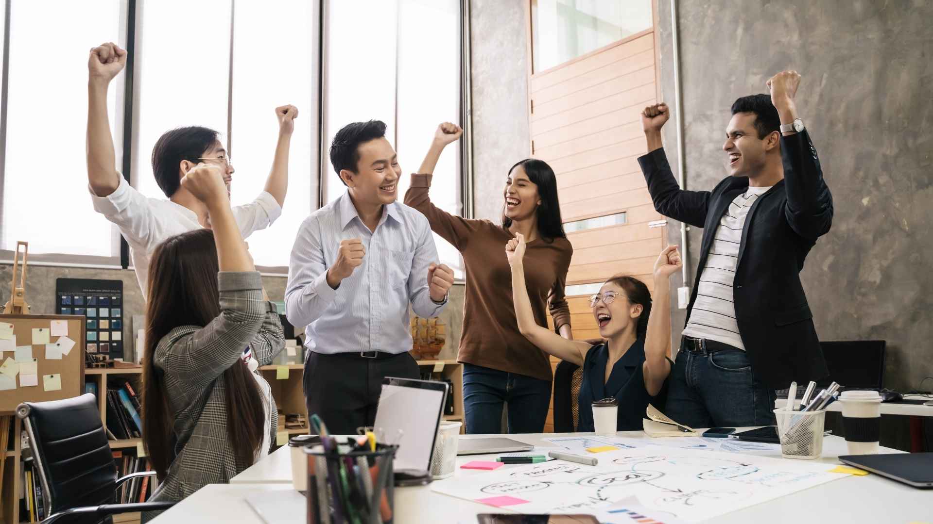 digital marketing team celebrating success