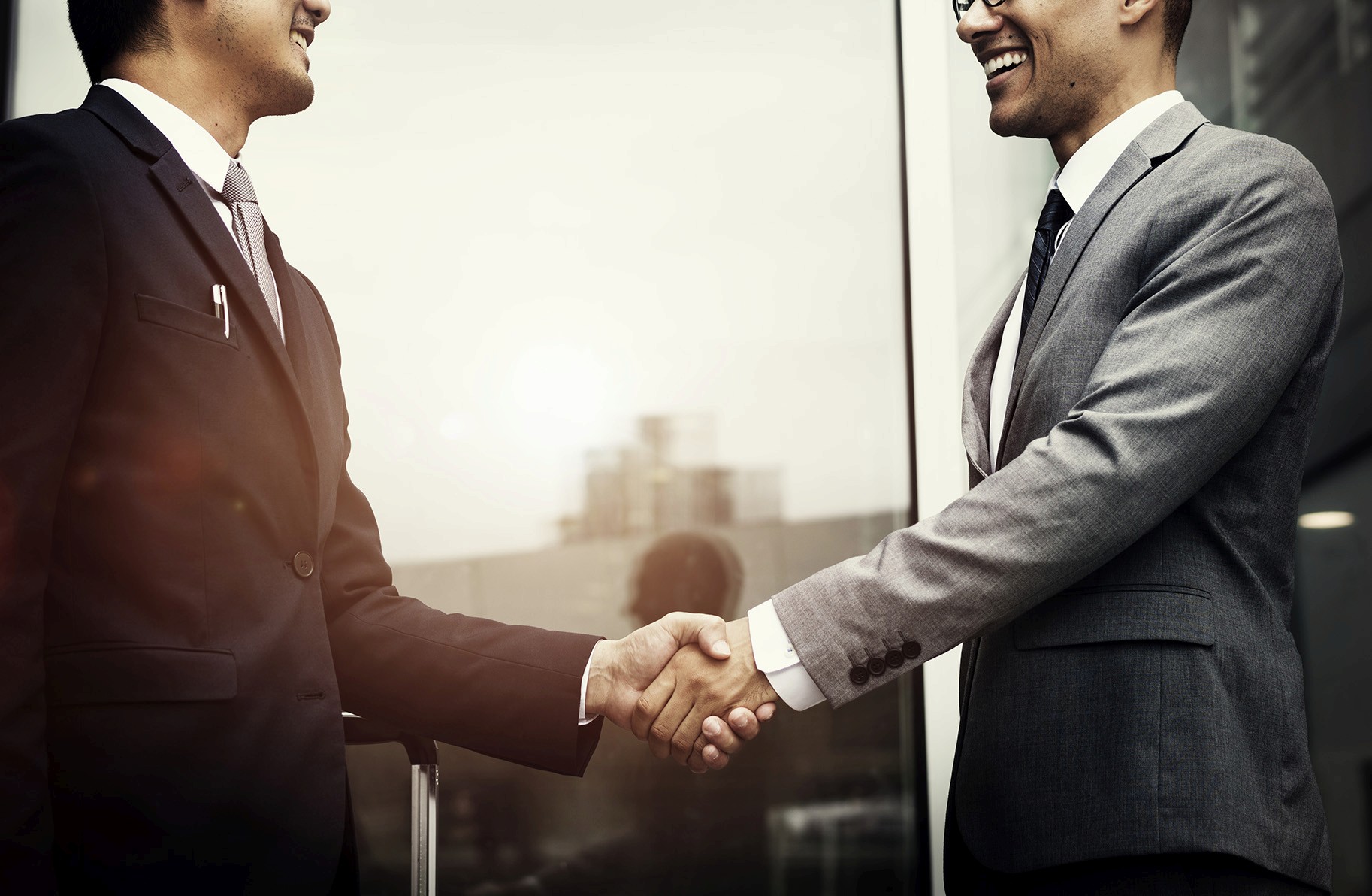 Peter Chy Real Estate transaction closing handshake, symbolizing partnership and trust in Cambodia investment.
