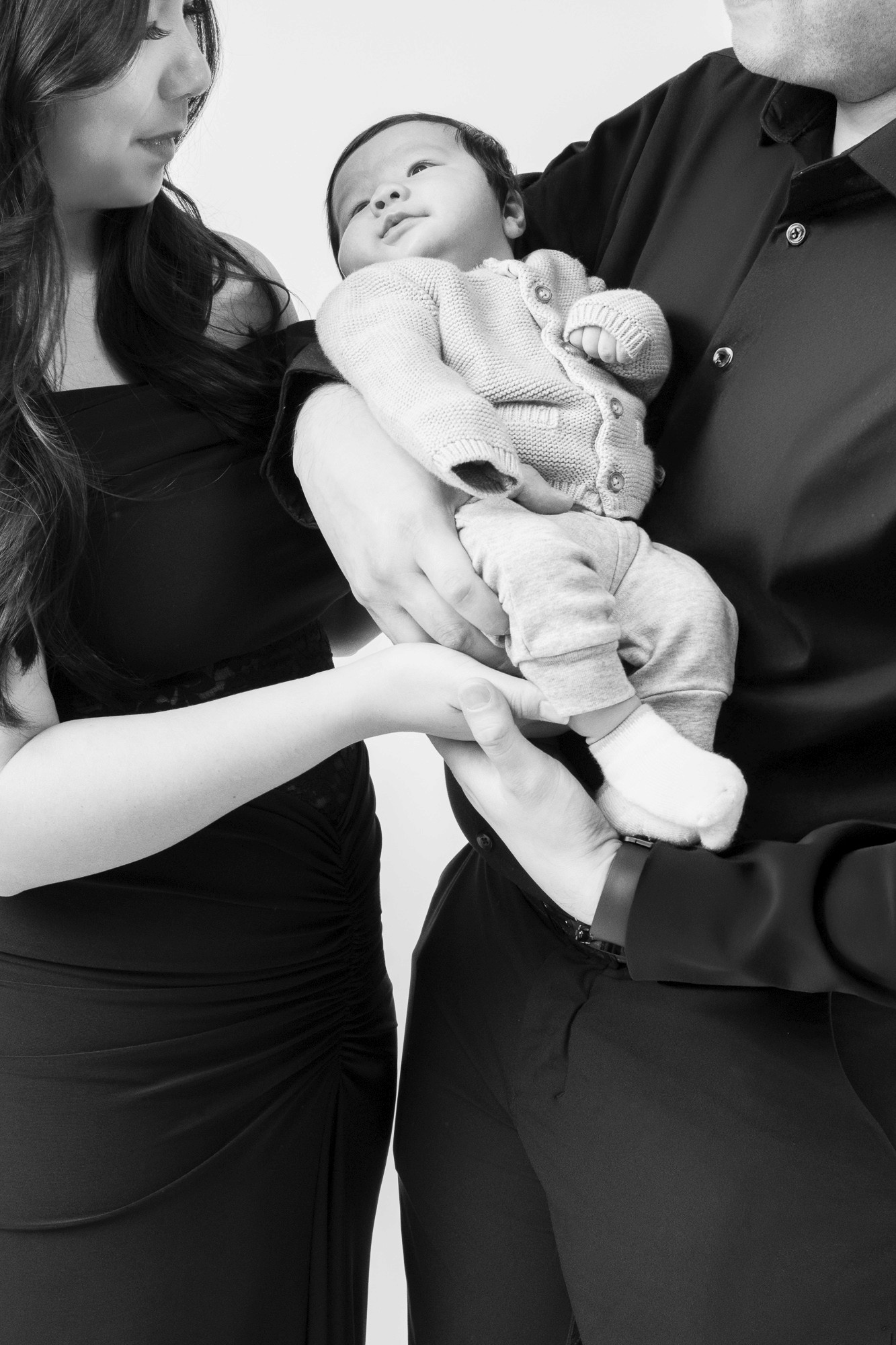 woman in brown long-sleeved top standing beside wall