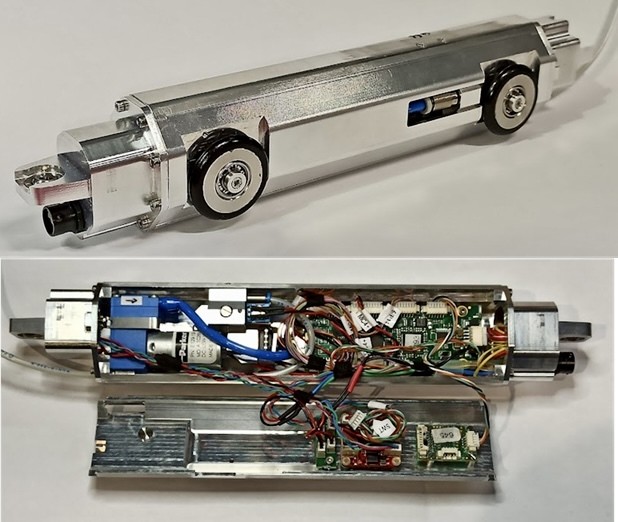 DA_TLR miniature inspection robot: aluminium crawler chassis and its opened electronics bay