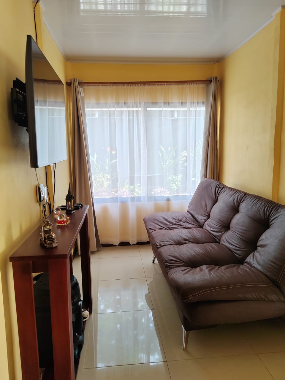 an aerial view of a beach surrounded by trees
