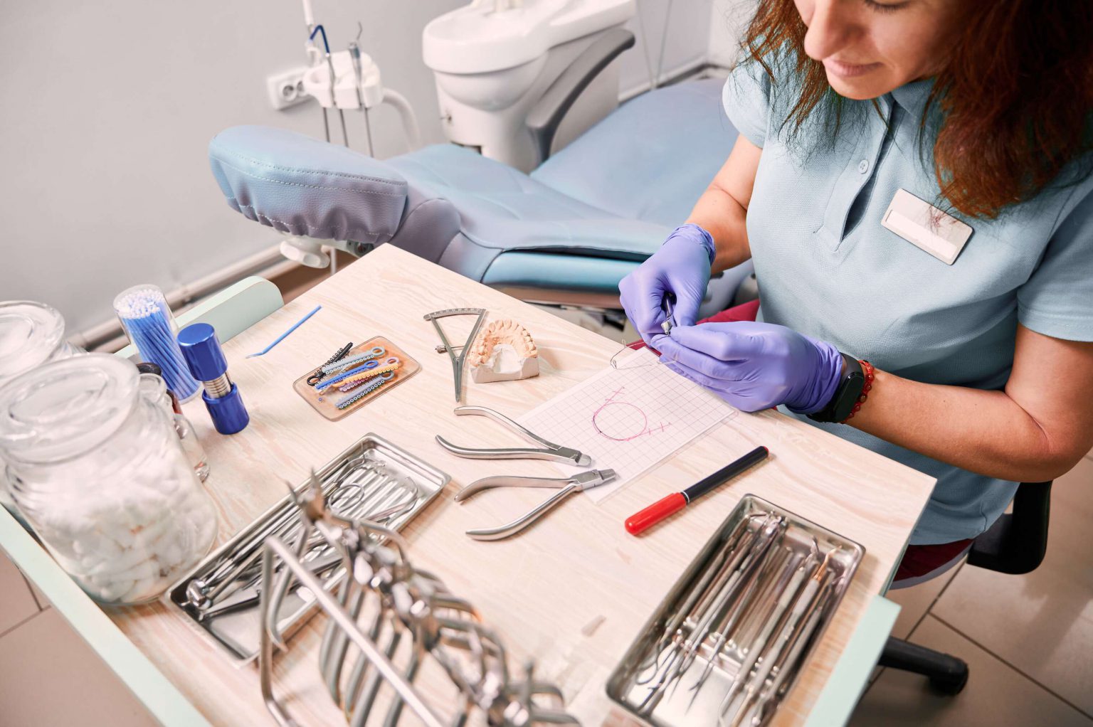 Dentist inspecting tools