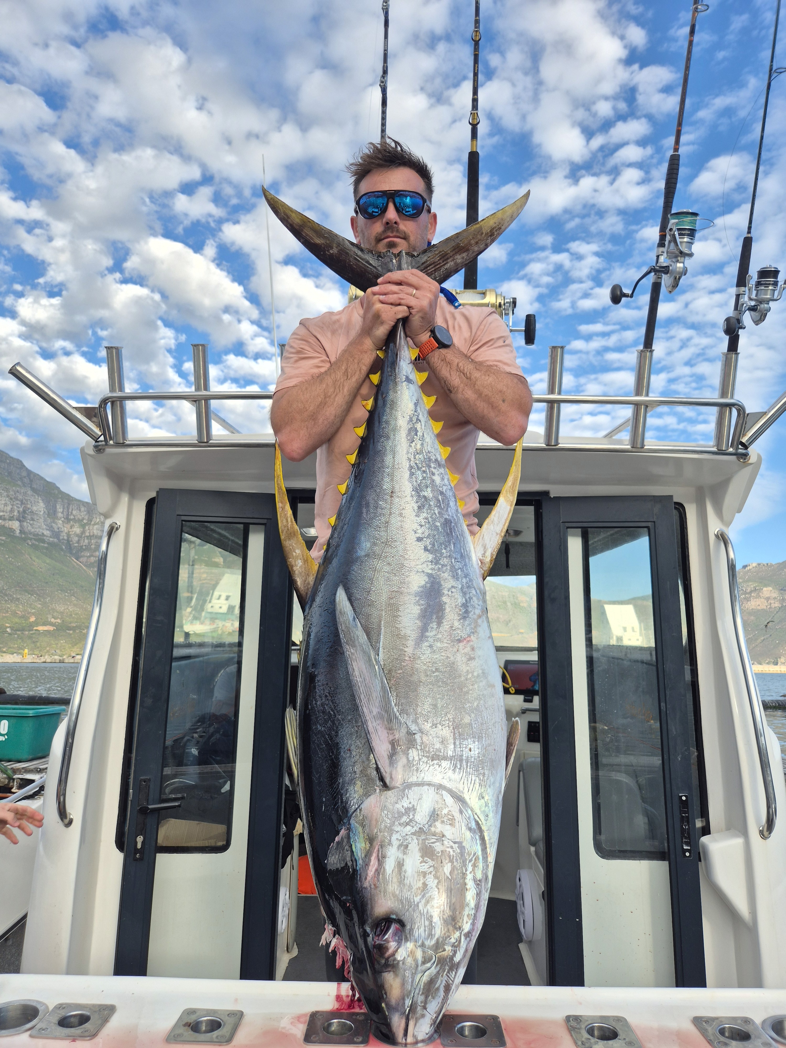 Fishermen celebrating a successful catch on a Salt Safari charter.