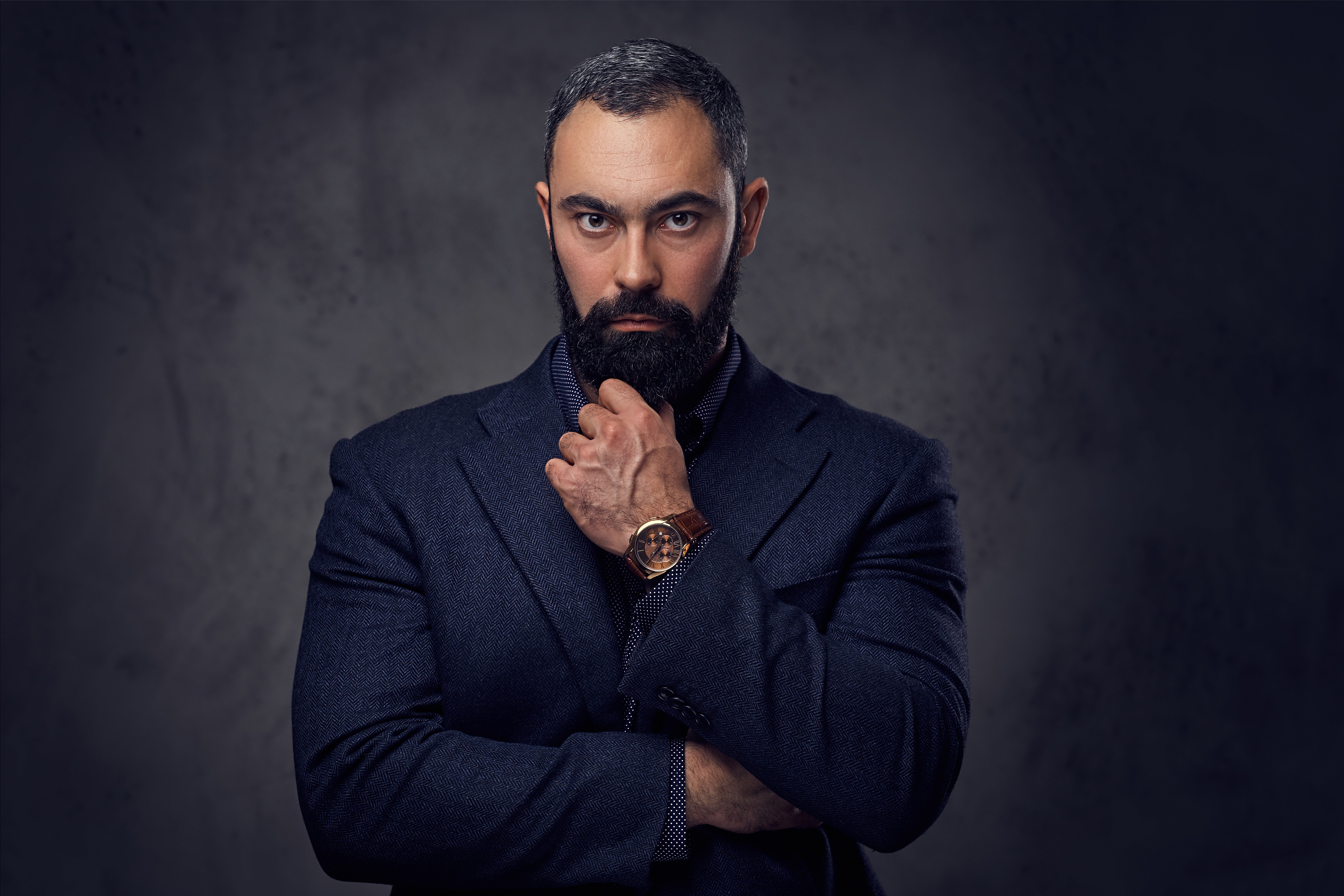 man self portrait wearing gray and white collared button-up shirt near green leaf plant with white ceramic pot