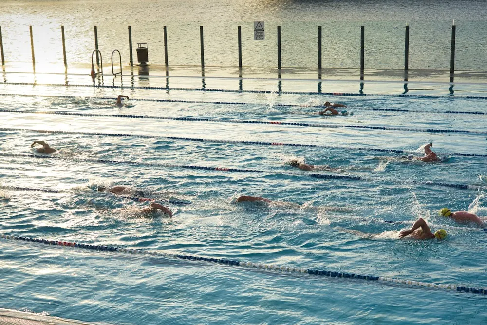Swimmers doing lengths in an outdoor pool