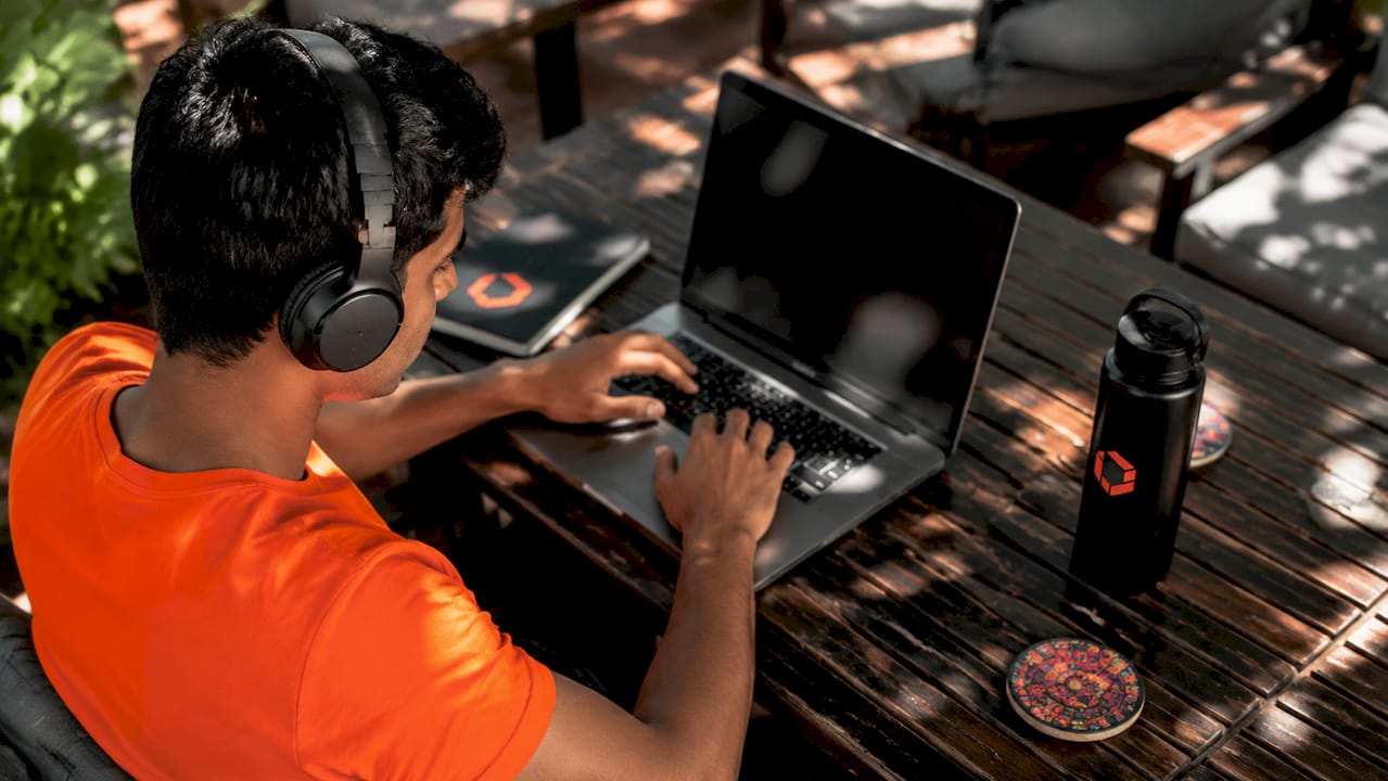 Developer beta testing app on laptop in co-working space