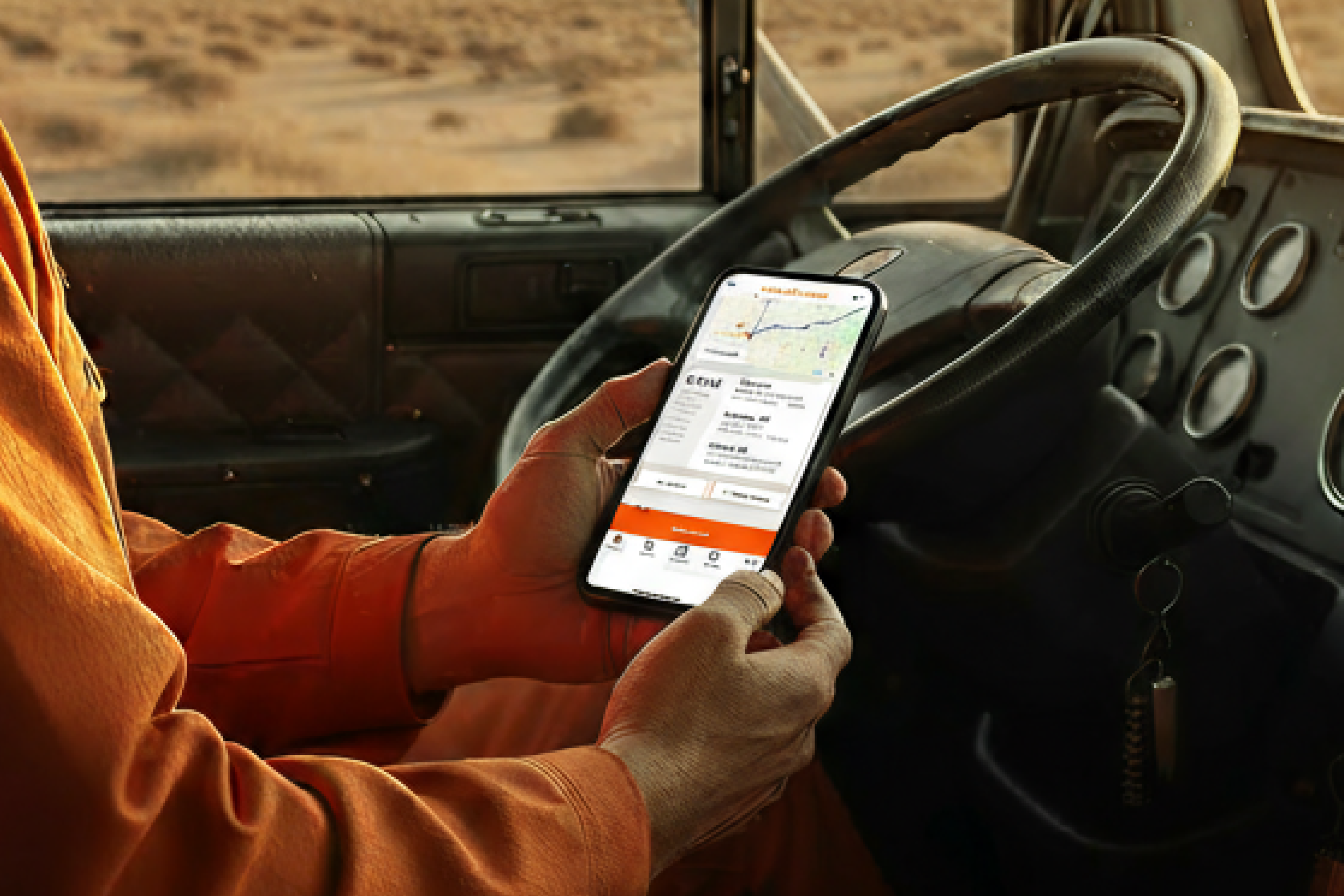 Trucker checks Scheider app screen