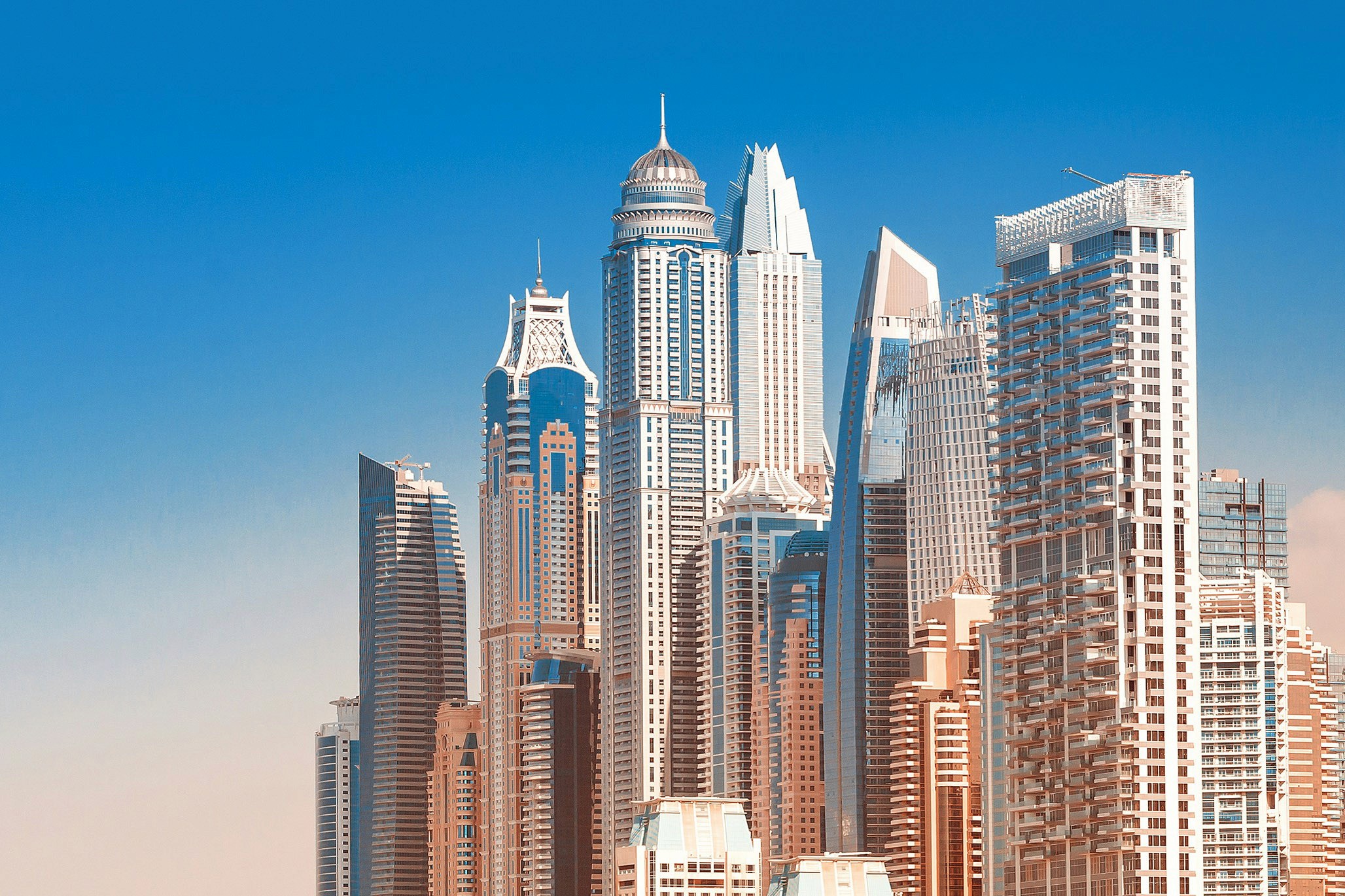 promenade canal dubai marina with luxury skyscrapers