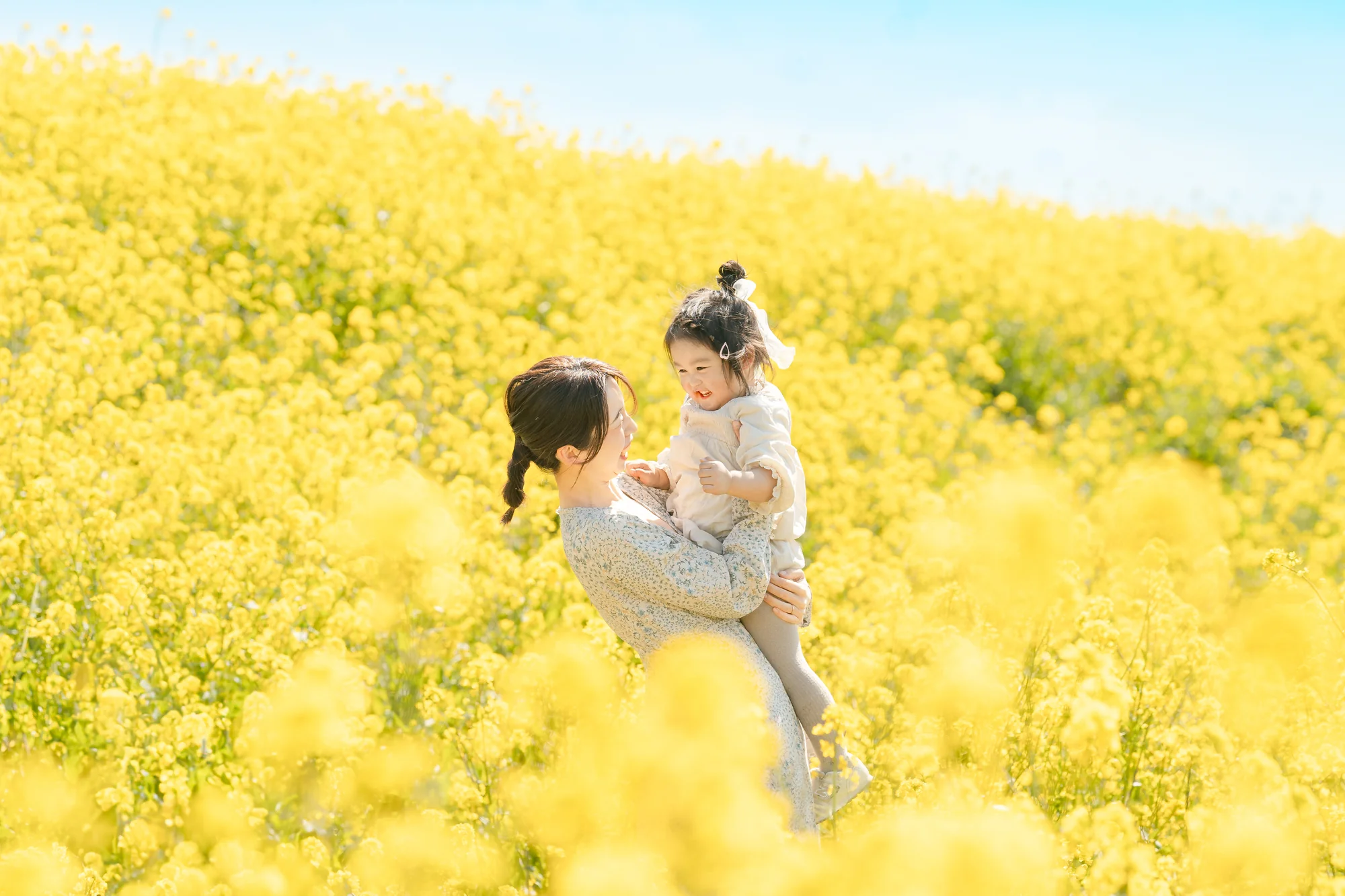 Empty historic lecture hall with curved wooden seating and a classical painting on the wall
