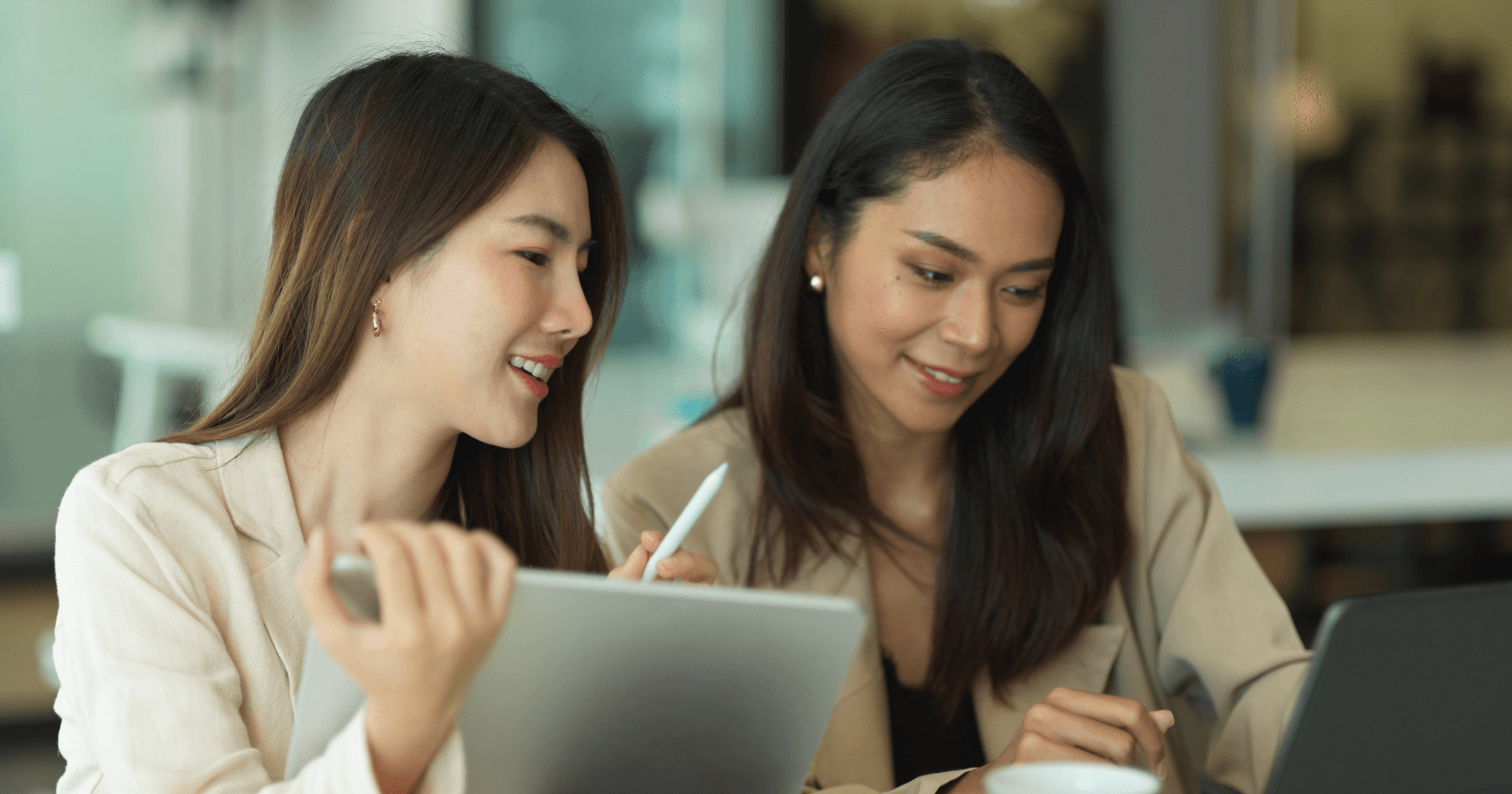 Two businesswomen checking out tax relief options