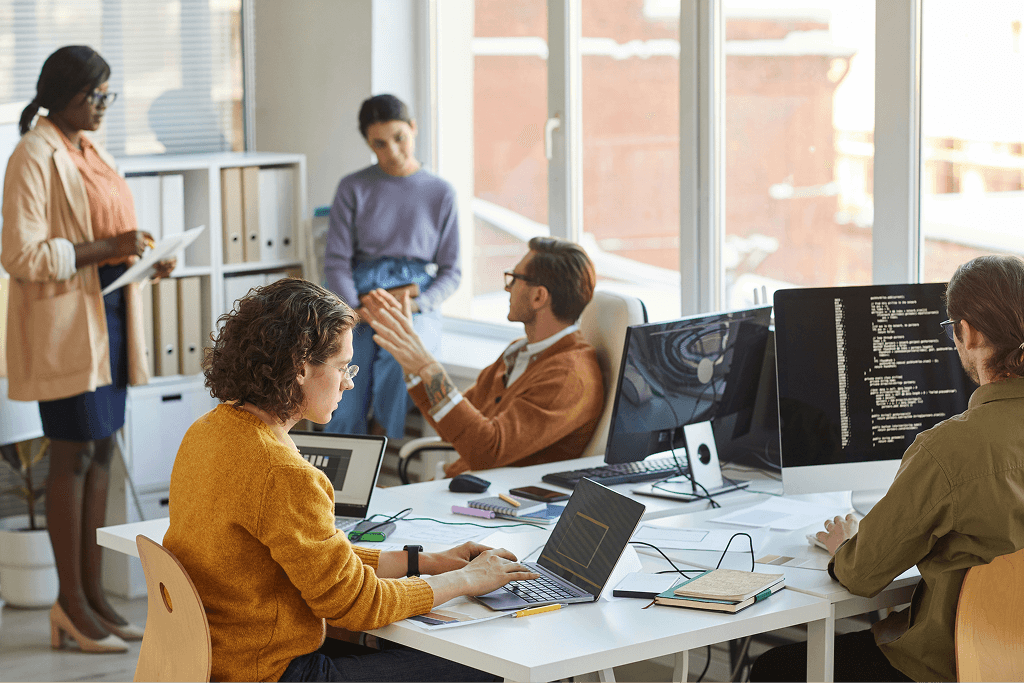 Man with a laptop walking to a store