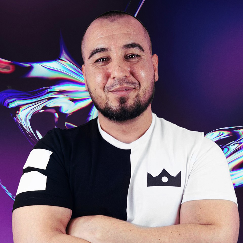 Portrait of a woman with long, smooth hair swept to the side, in a dark t-shirt, on a plain background.