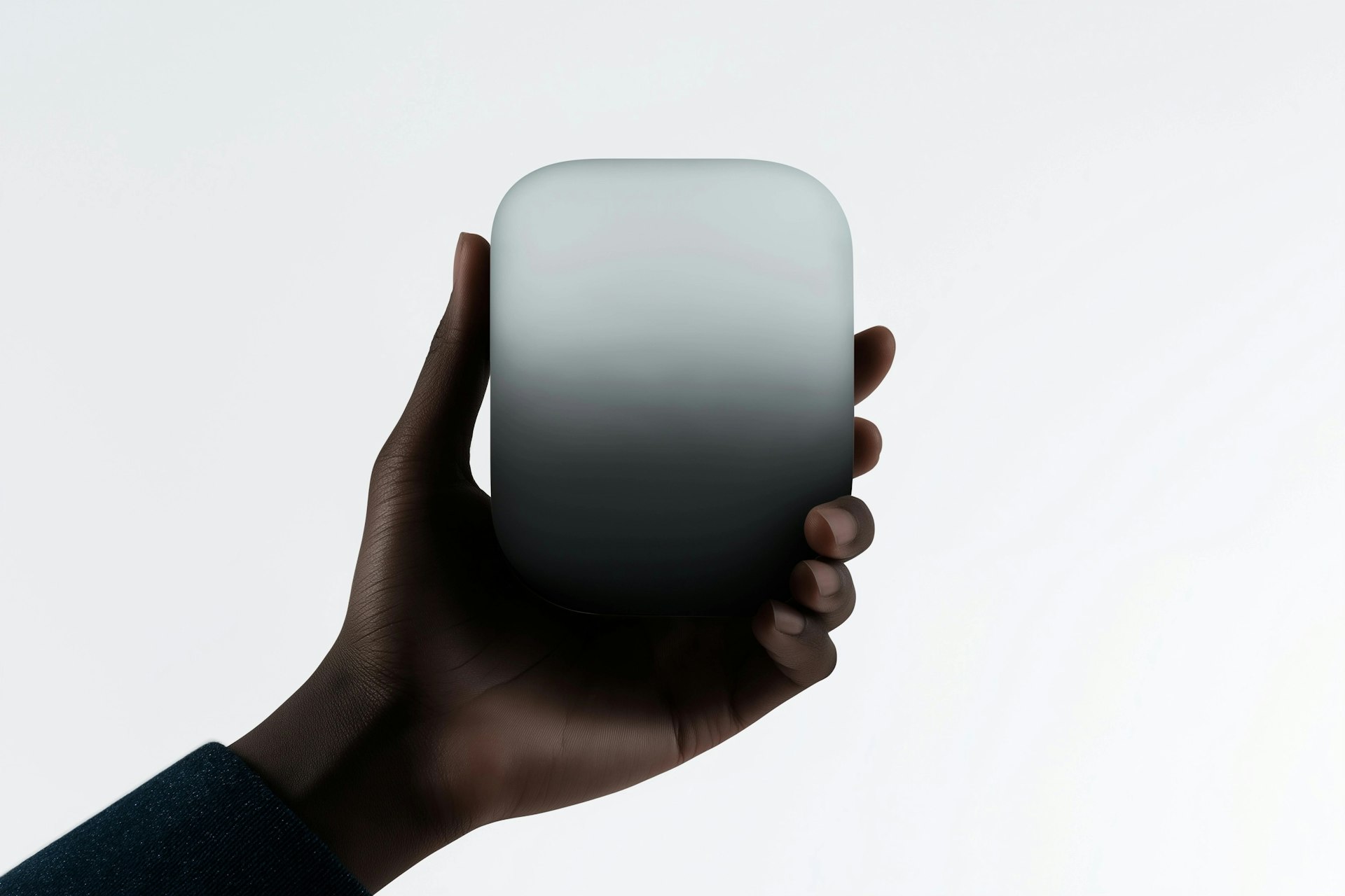 Hand holding a sleek rectangular object on white background, conveying minimalism and product focus in the Frysta Framer Template by Orbitx Supply.