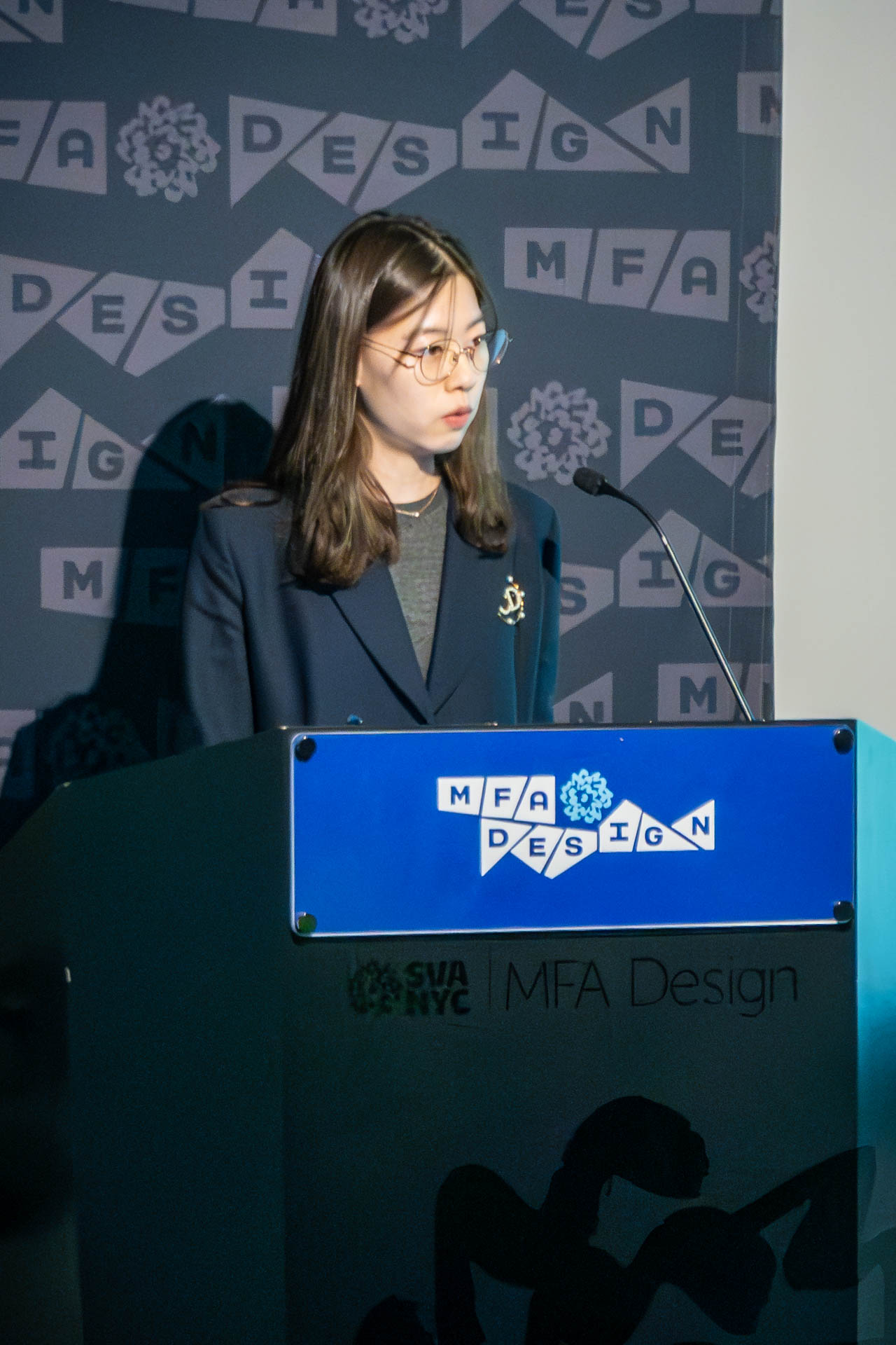 student at a podium giving a presentation