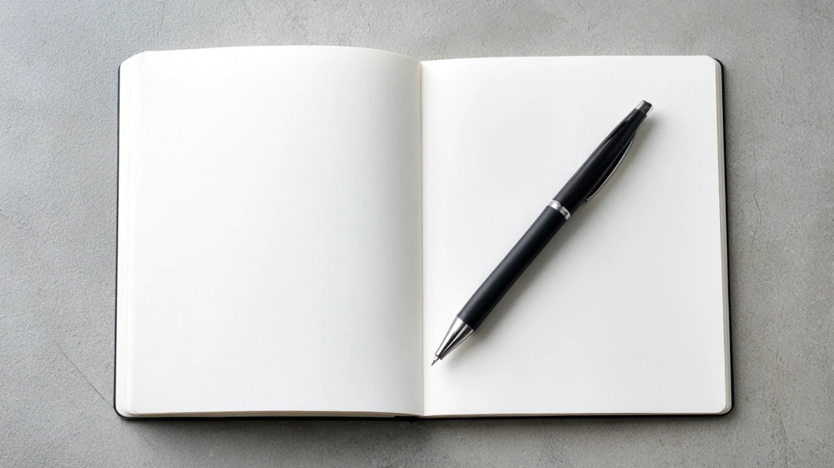 Open notebook with pen on simple surface