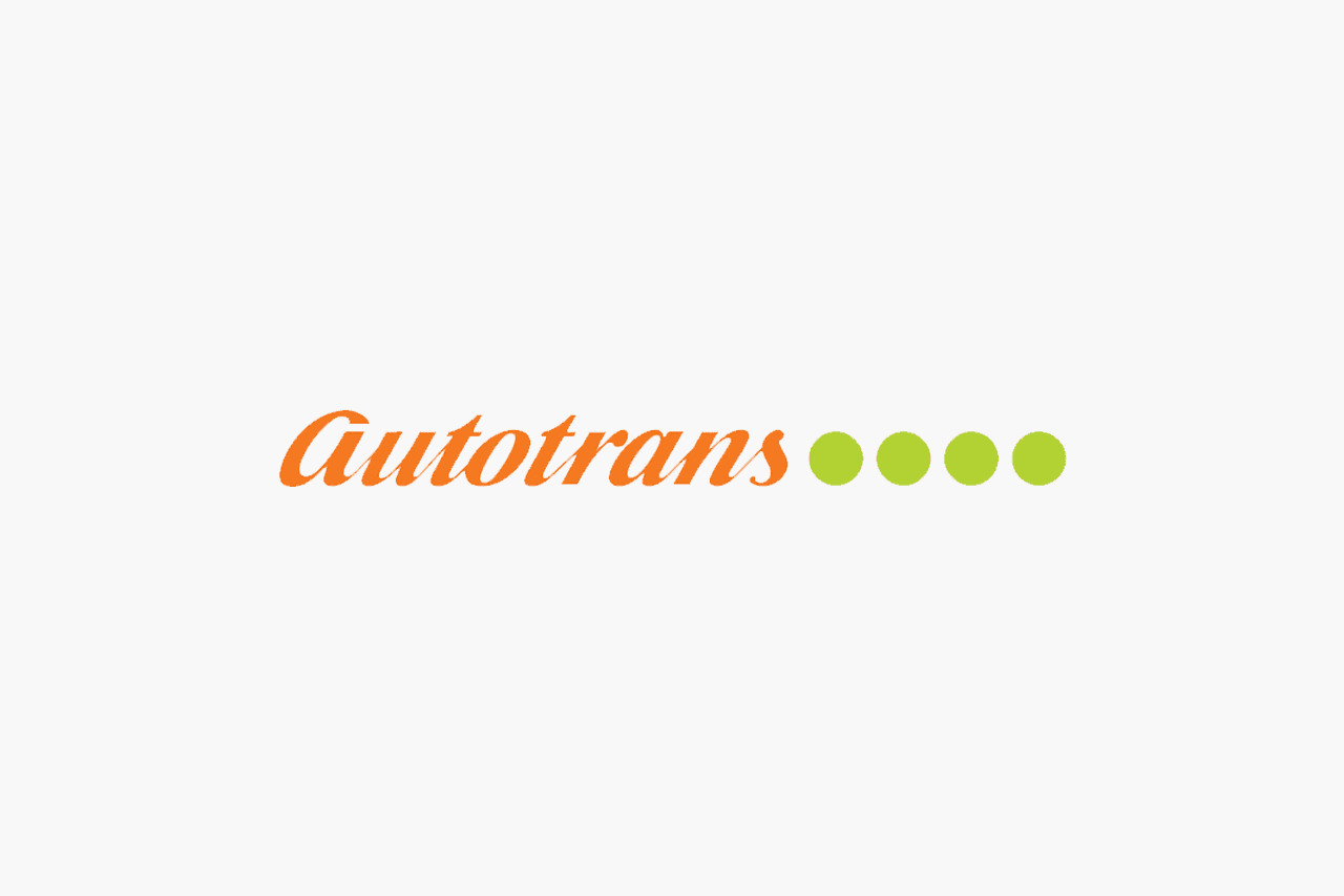 Autotrans Logo. Orange lettering with 4 green circles to the right