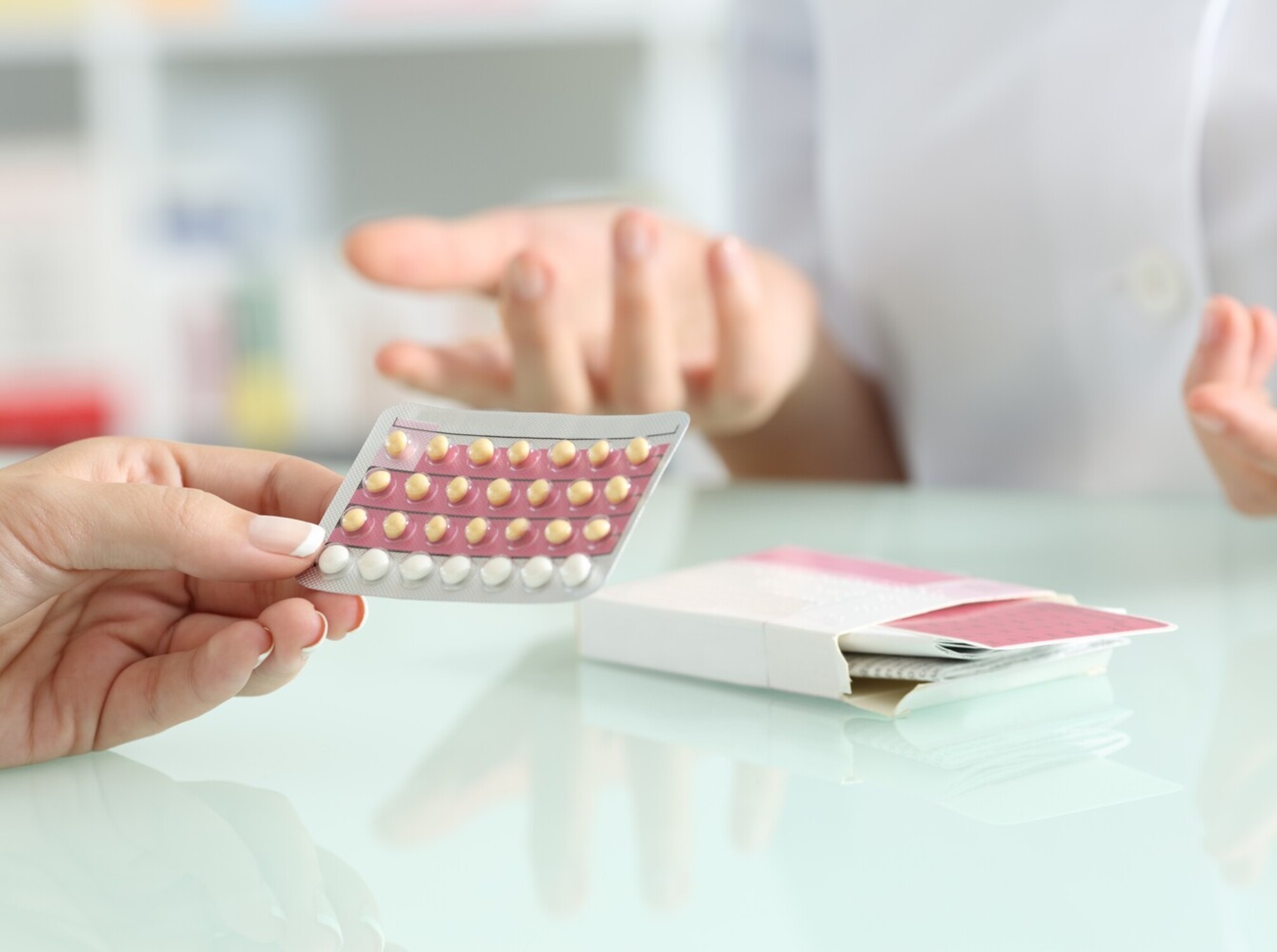 patient discussing birth control and weight gain concerns with her OBGYN