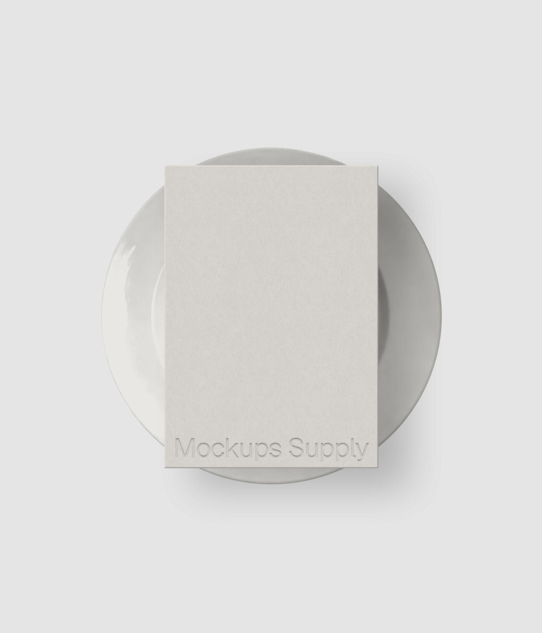 Restaurant menu mockup on plate with subtle debossed typography and soft lighting