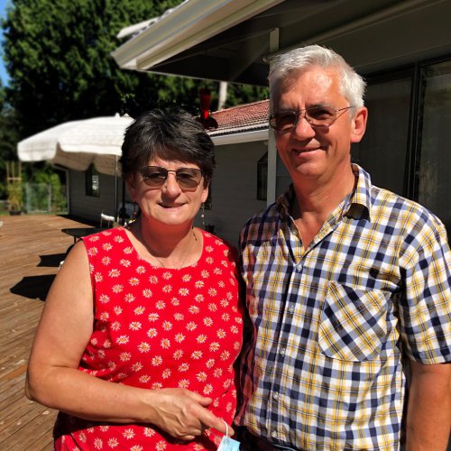 Husband and wife owners smiling