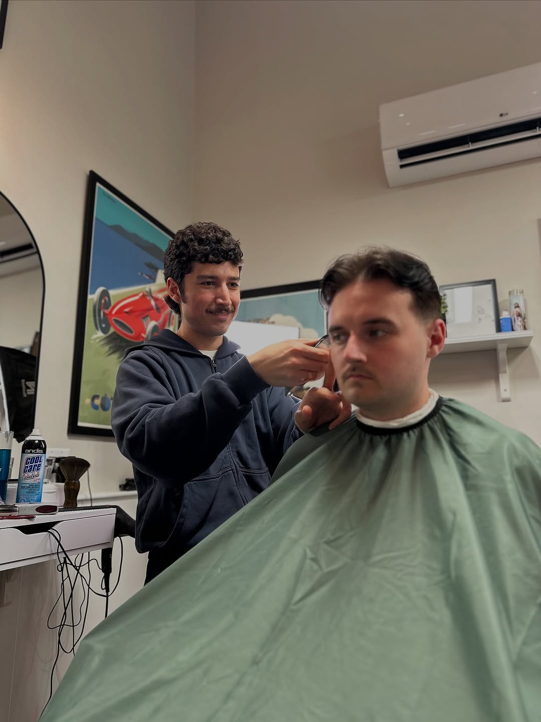 Anton wearing a navy hoodie mid-service