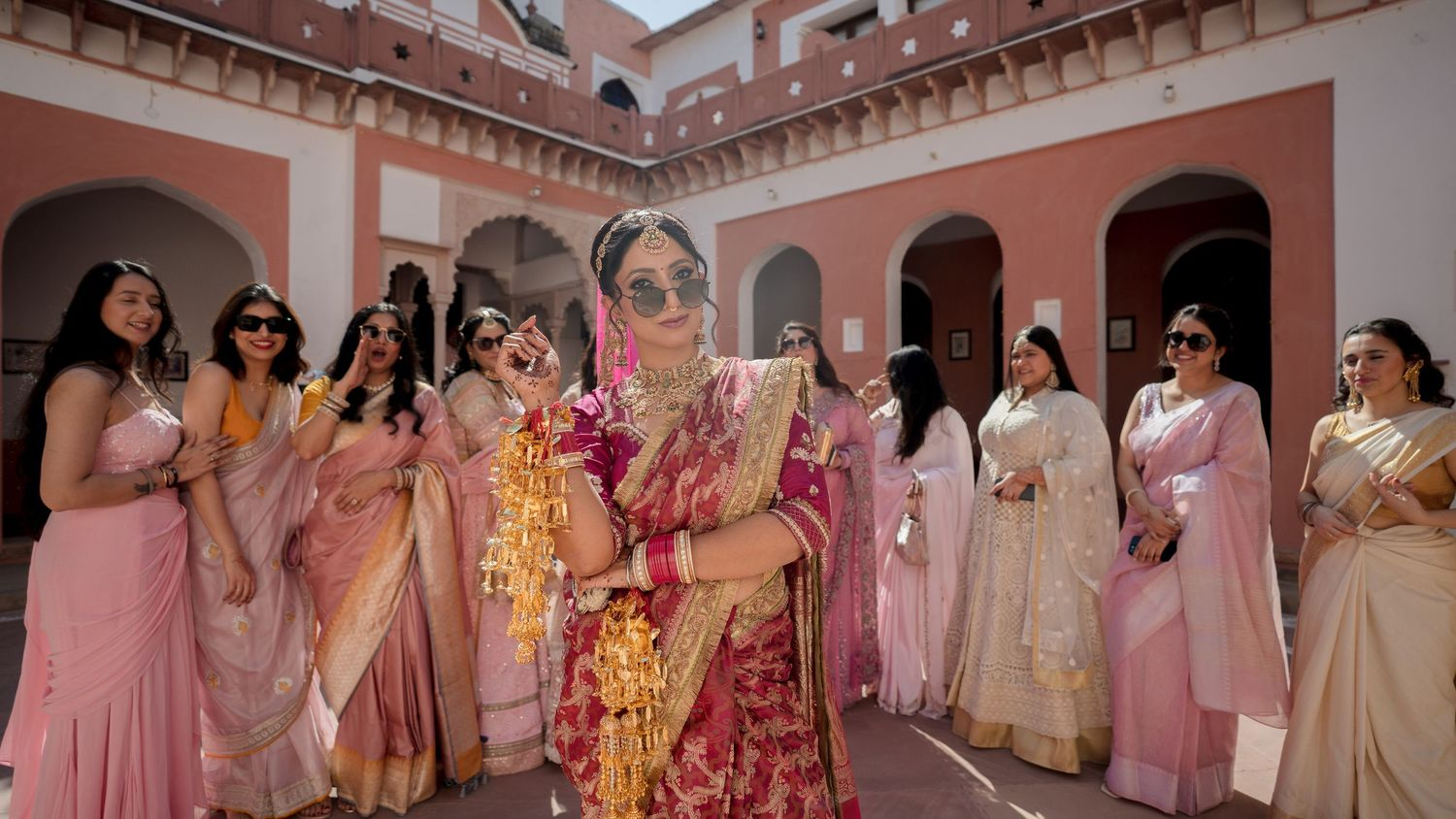 bride with bridesmaids candid wedding celebration friends group vibrant moment