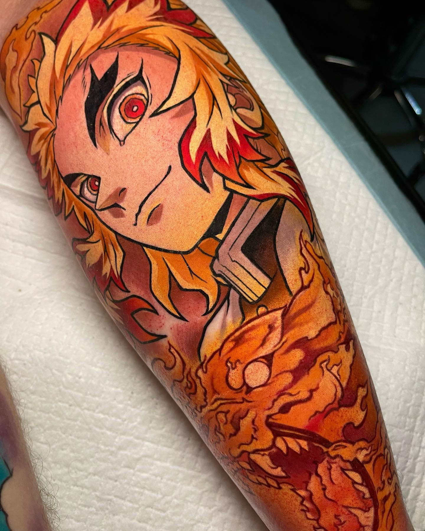 colorful anime tattoo of rengoku from demon slayer the anime