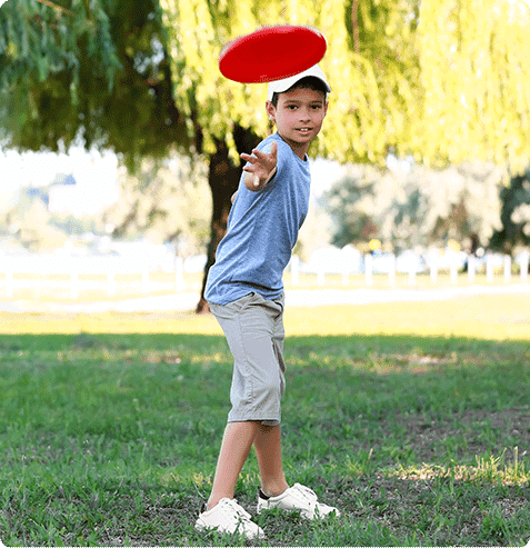 Elementary students participating in an ultimate frisbee activity during a HOKALI after-school sports program