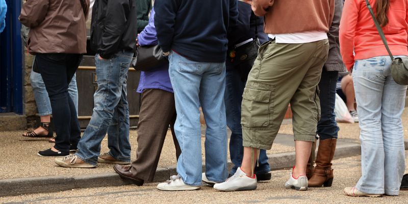 A long line of customers outside a restaurant