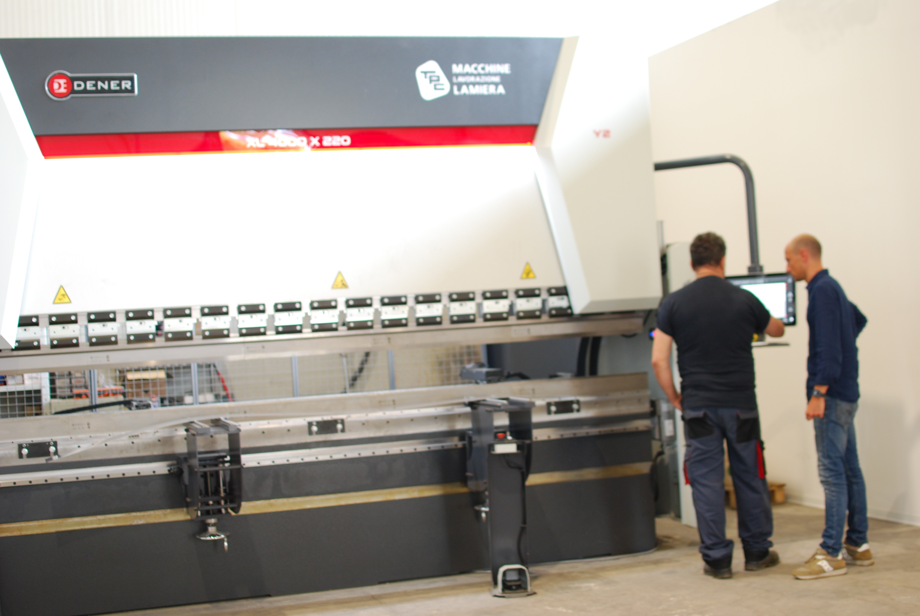 a man welding a piece of metal in the dark