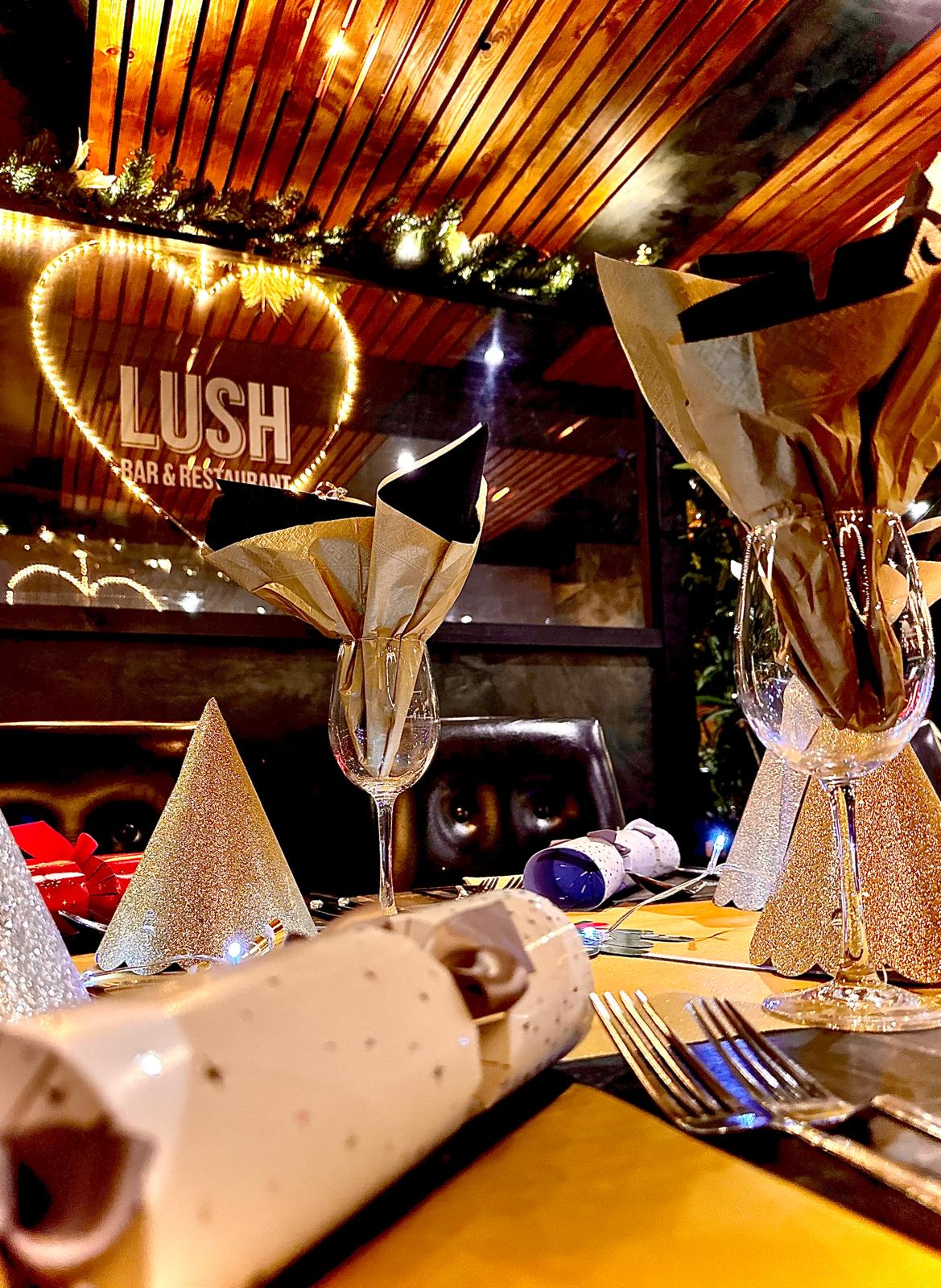 Wine glasses with christmas napkins in a christmassy Lush. Christmas at Lush Restaurant and Barn in Barnstaple.