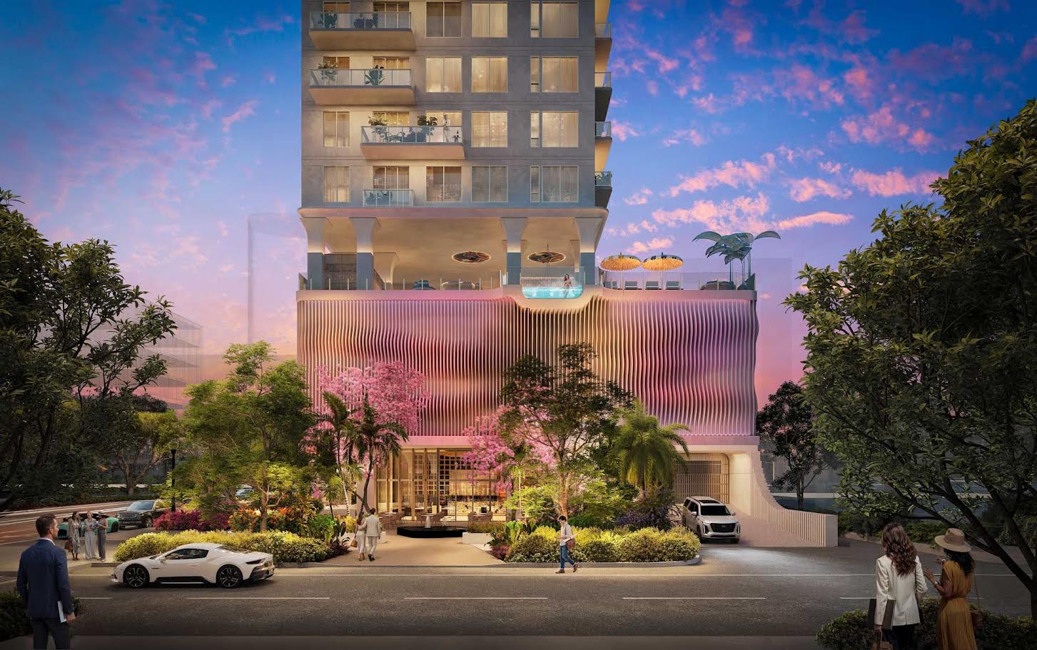 Street-level rendering of the Roche Bobois St. Pete Tower podium with tropical landscaping, palm trees, and pedestrians at the entrance in downtown St. Petersburg