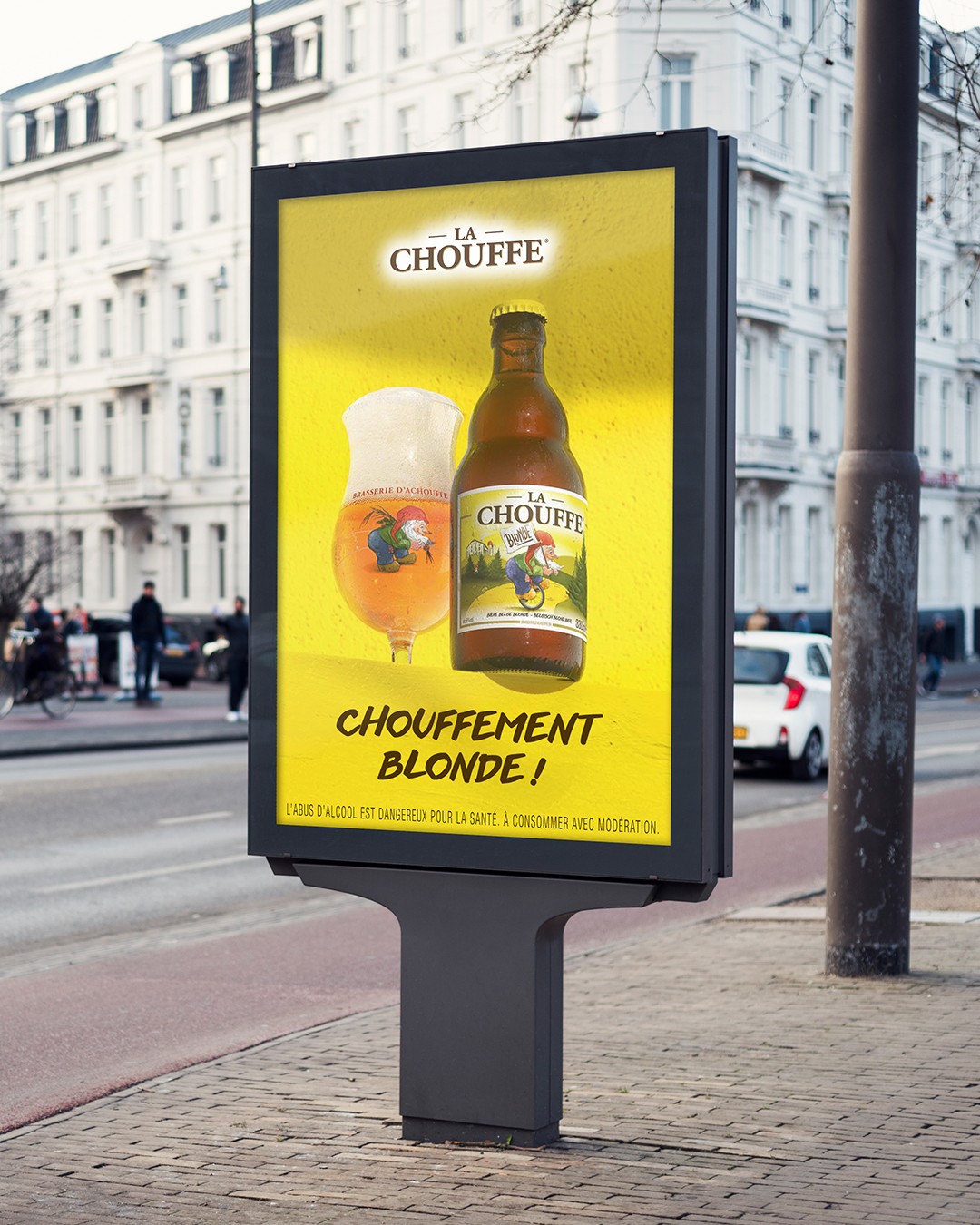 Streetside billboard with flyposters of the Batch.Works brand and illustrations