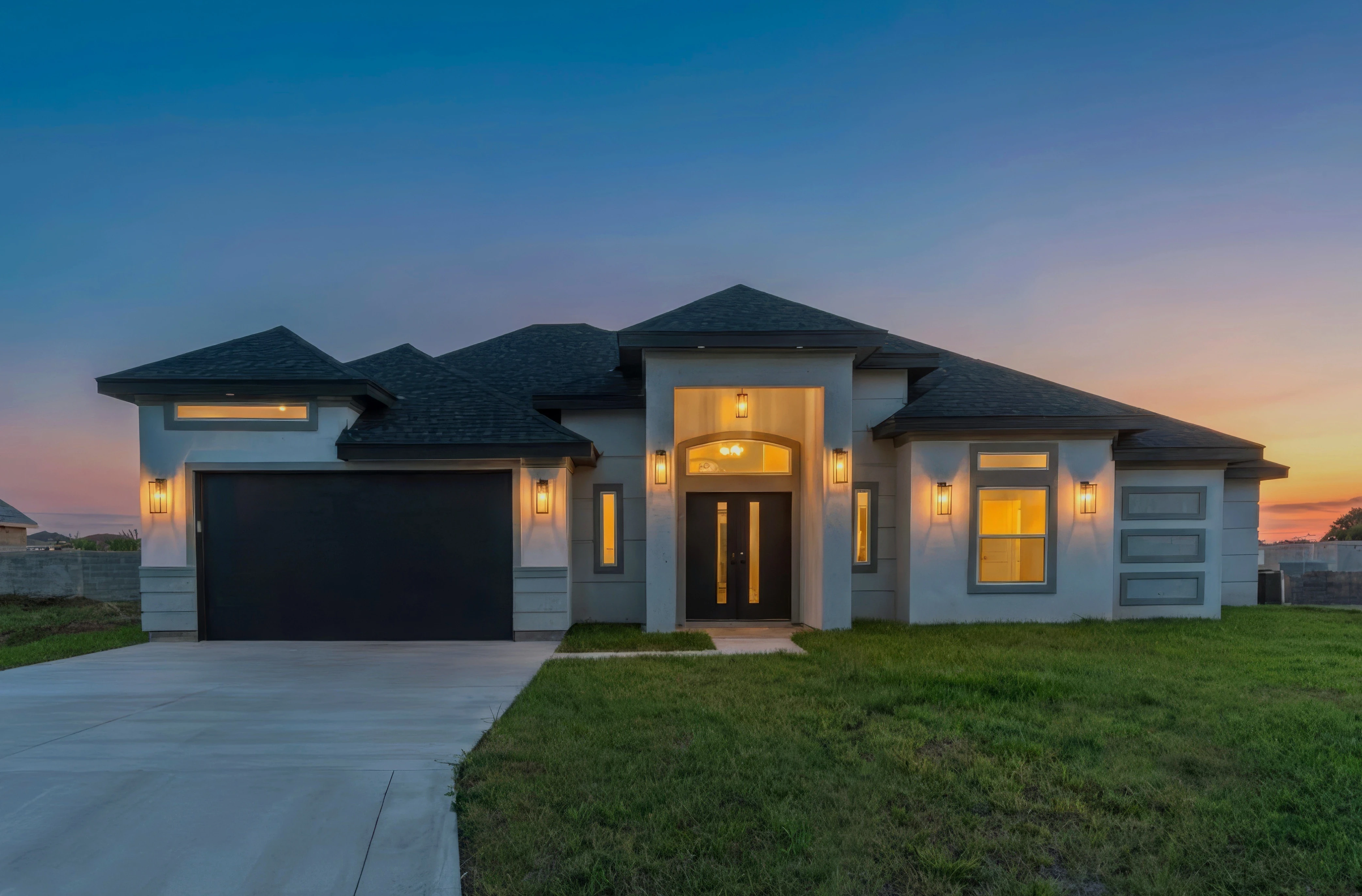 A picture of a house during twilight.