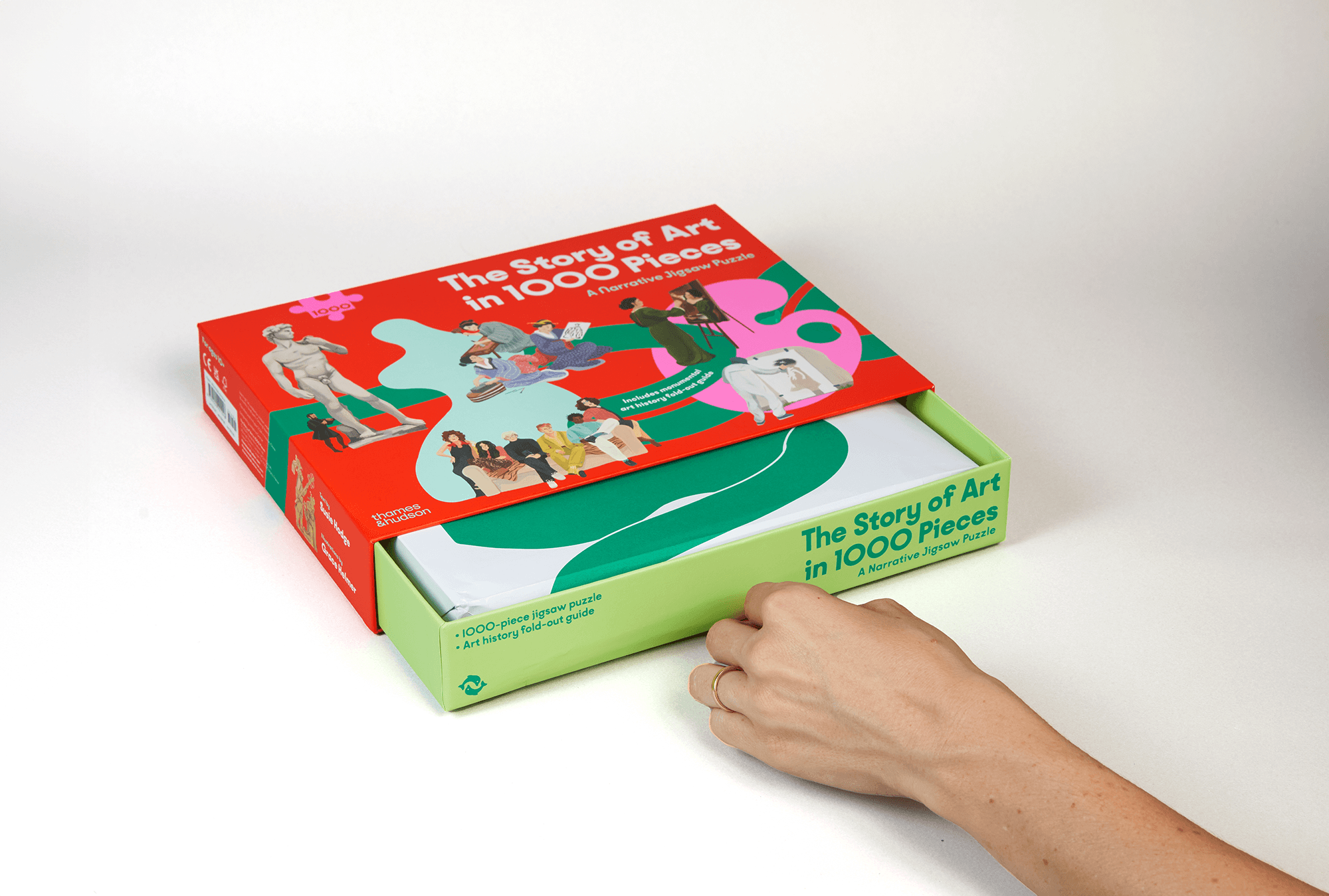 Thames & Hudson’s The Story of Art 1000-piece puzzle box being opened, highlighting the colorful art-history themed packaging design.