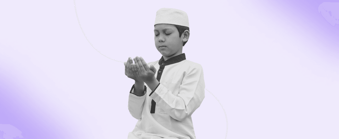 Young child in praying with eyes closed and hands raised in supplication, highlighting the importance of teaching kids to pray.