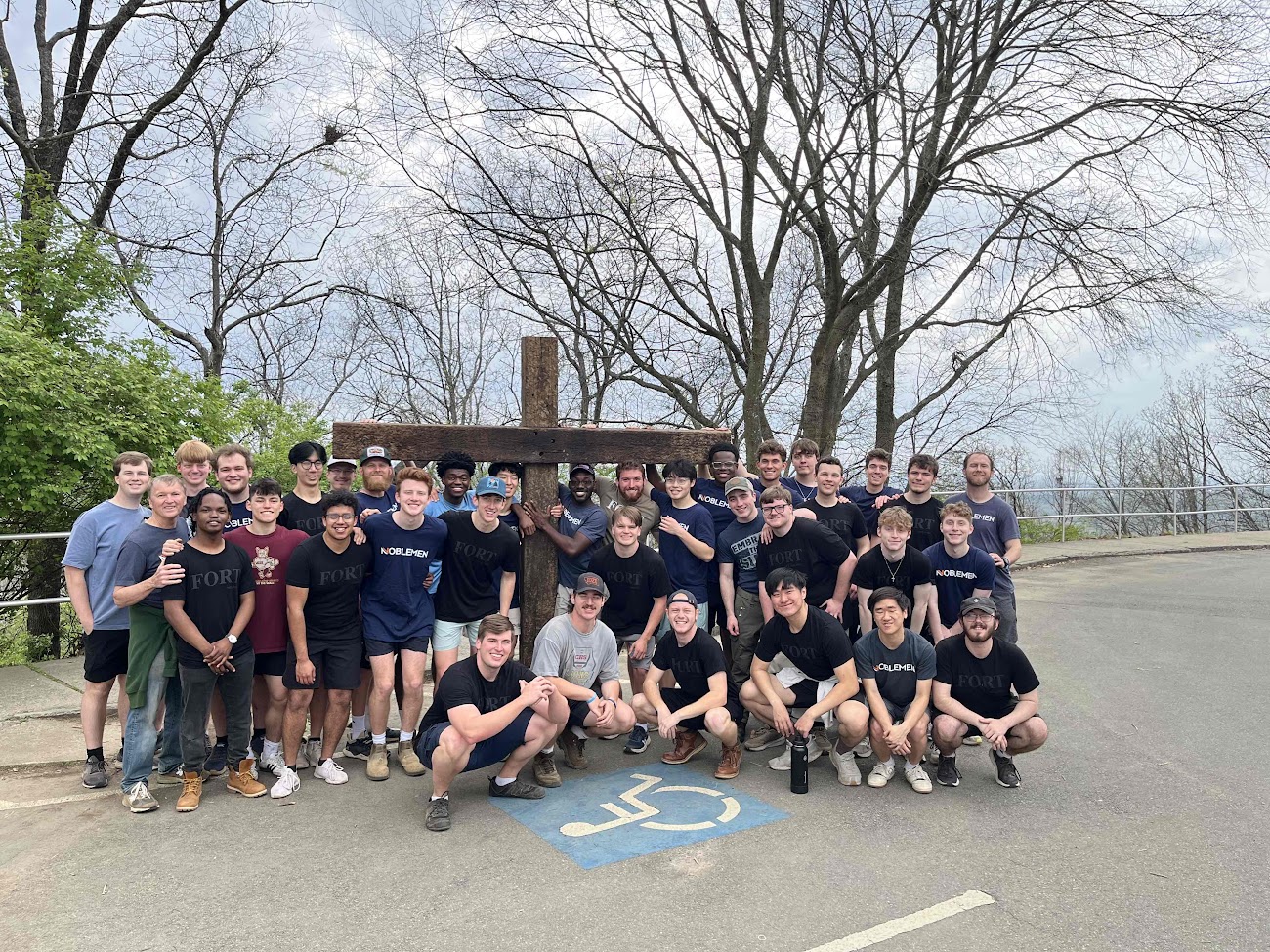 Two figures holding red and blue circles over their faces on yellow background.