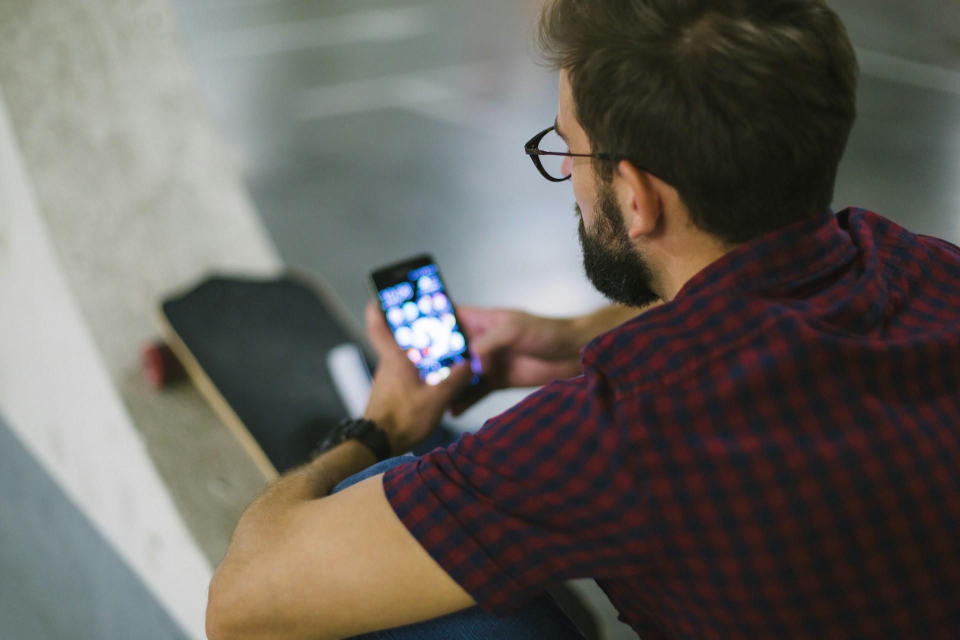 A person sitting holding a phone
